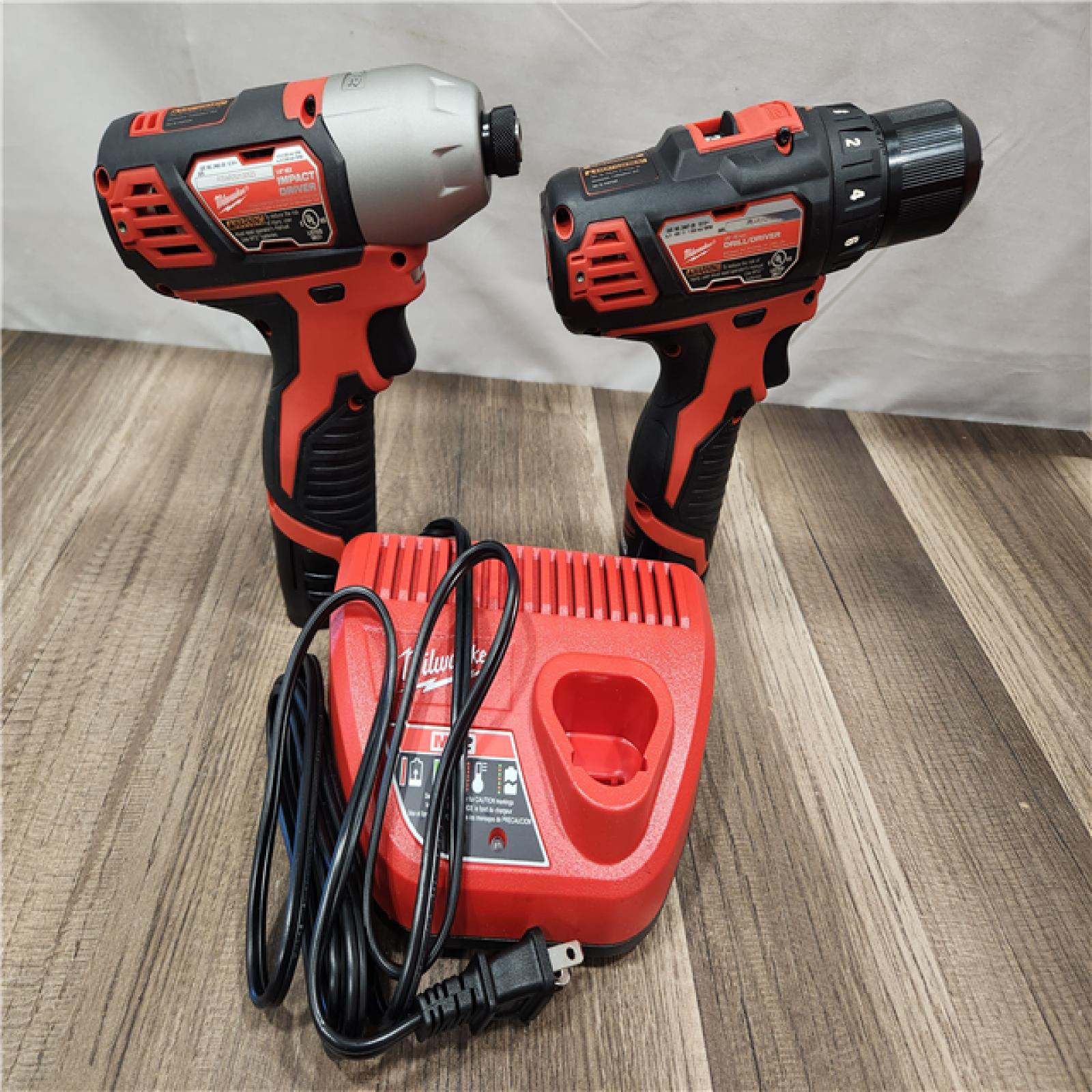 AS-IS- Milwaukee M12 Cordless Combination 3/8  Drill / Driver and 1/4  Hex Impact Driver Dual Power Tool Kit (2 Lithium Ion Batteries  Charger  and B