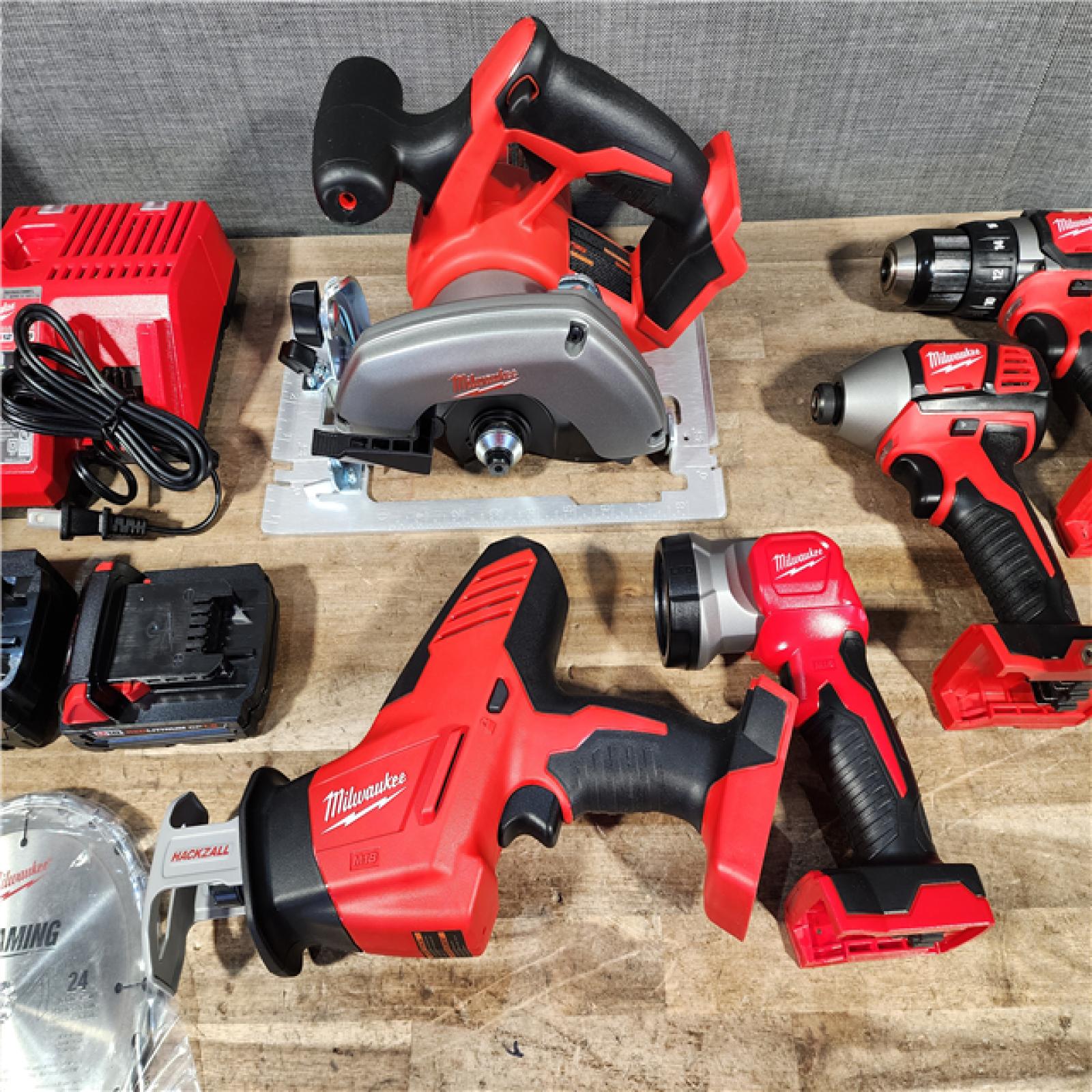 HOUSTON LOCATION - AS-IS Milwaukee M18 18-Volt Lithium-Ion Cordless Combo Tool Kit (5-Tool) with (1) 3.0Ah and (1) 1.5Ah Battery  (1) Charger  (1) Tool Bag