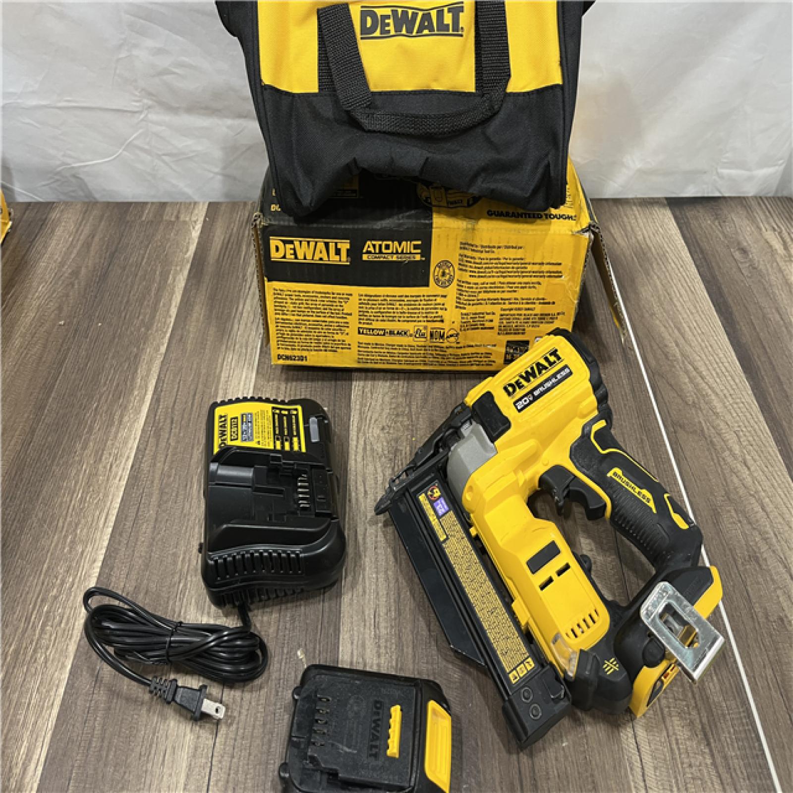 AS-IS DEWALT ATOMIC 20V MAX Lithium Ion Cordless 23 Gauge Pin Nailer Kit with 3.0Ah Battery and Charger
