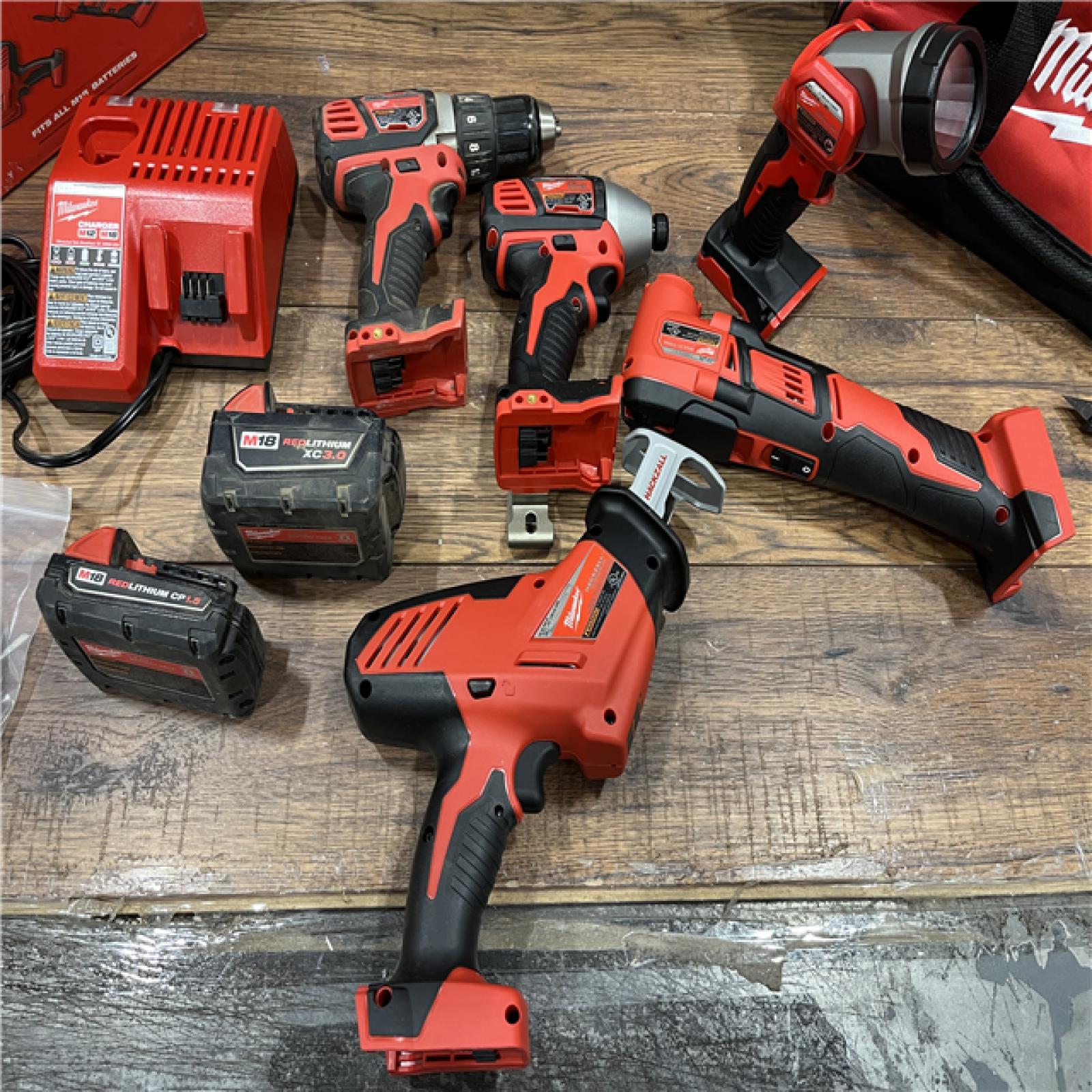 AS-IS Milwaukee M18 18V Lithium-Ion Cordless Combo Kit (5-Tool) with (2) Batteries, Charger and Tool Bag