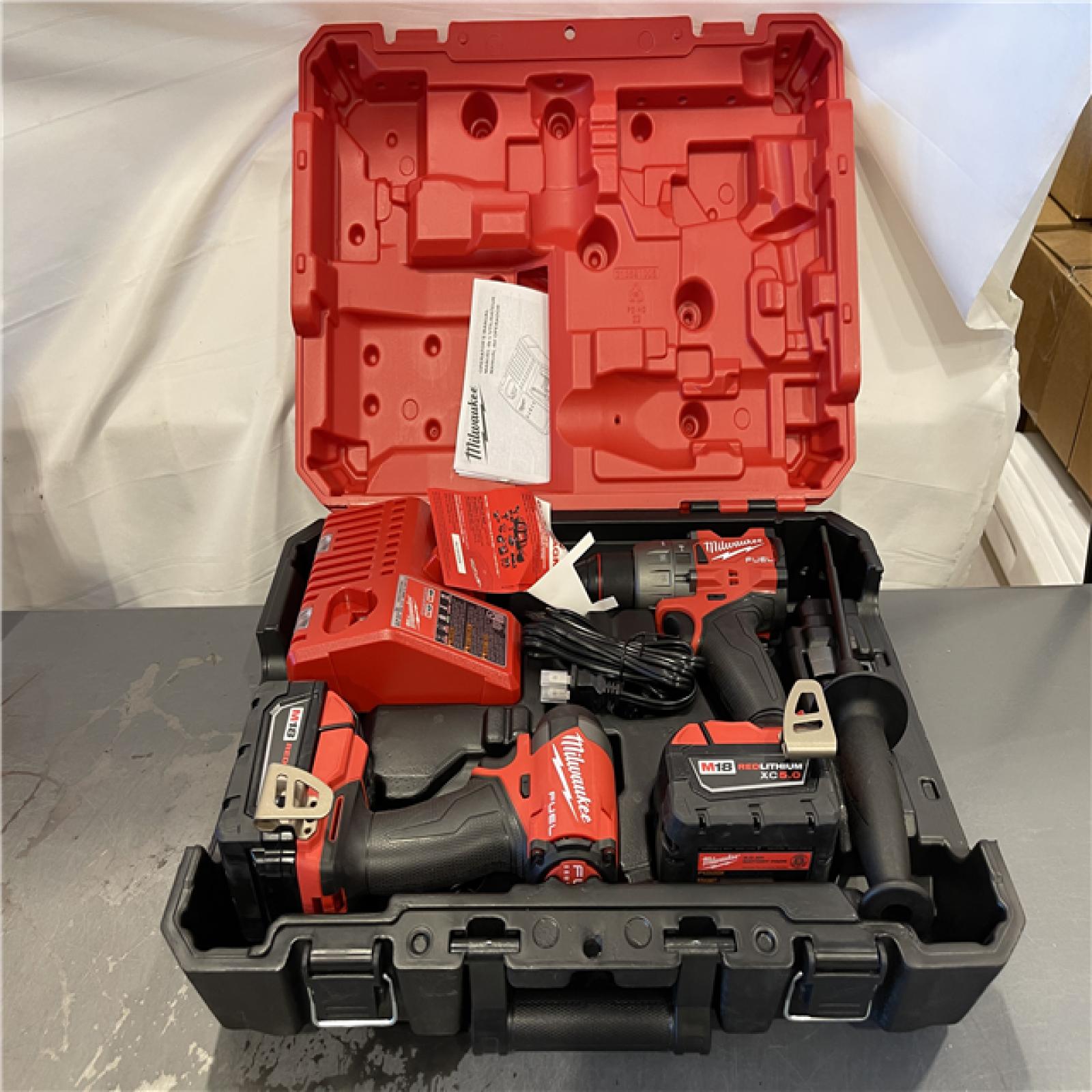 AS-IS - MILWAUKEE FUEL 18V Lithium-Ion Brushless Cordless Hammer Drill and Impact Driver Combo Kit