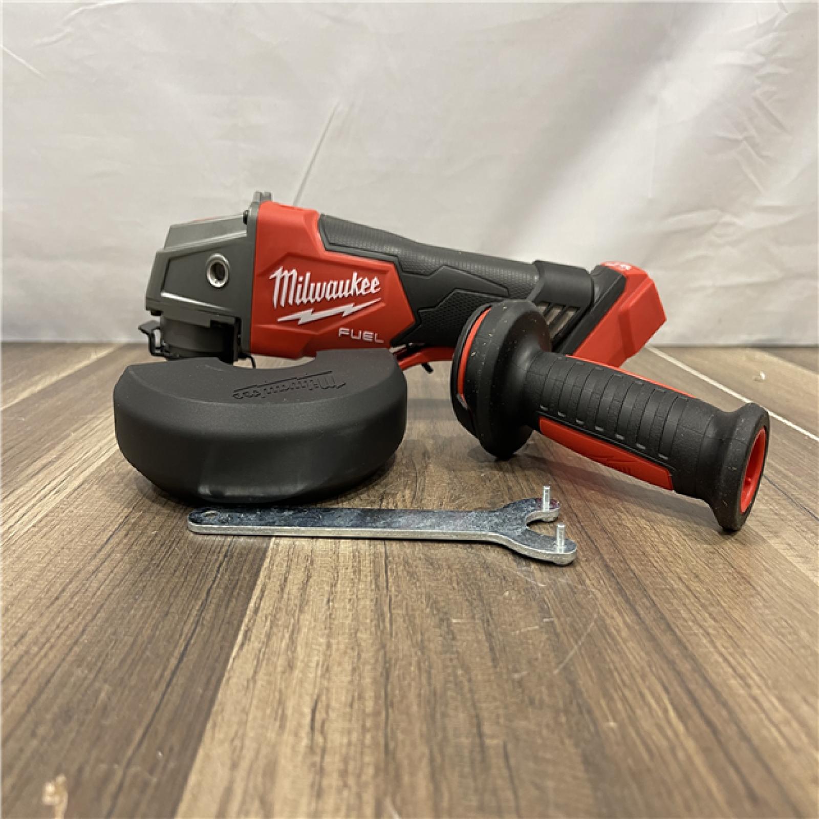 AS-IS Milwaukee FUEL 18V Lithium-Ion Brushless Cordless 4-1/2 in./5 in. Grinder w/Paddle Switch (Tool-Only)
