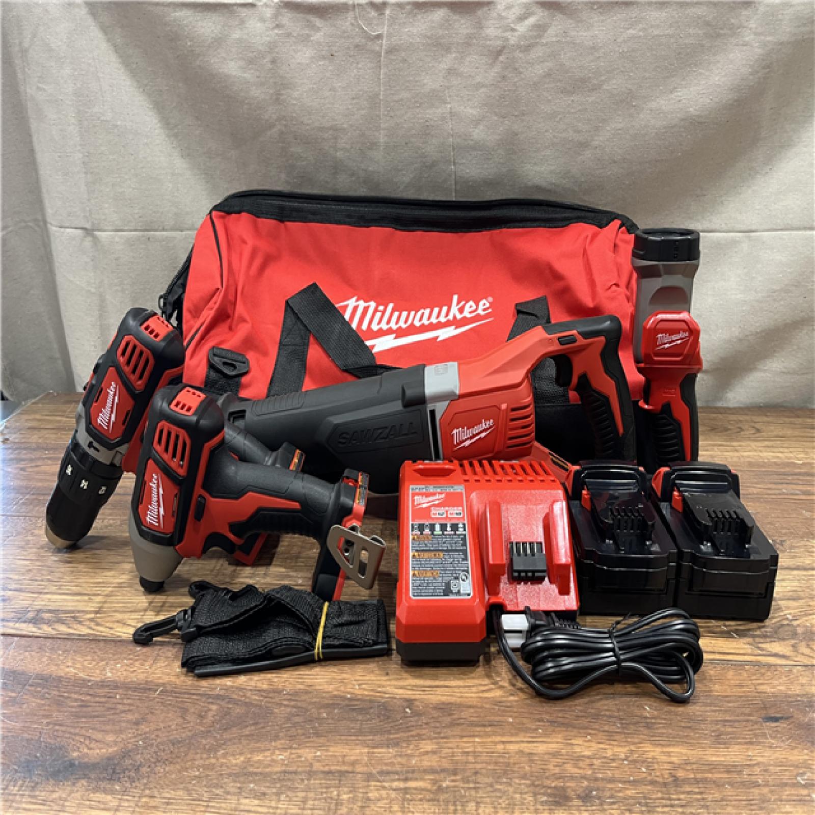 AS-IS MILWAUKEE M18 18V Lithium-Ion Cordless Combo Tool Kit with Two 3.0Ah Batteries, 1-Charger, 1-Tool Bag (4-Tool)