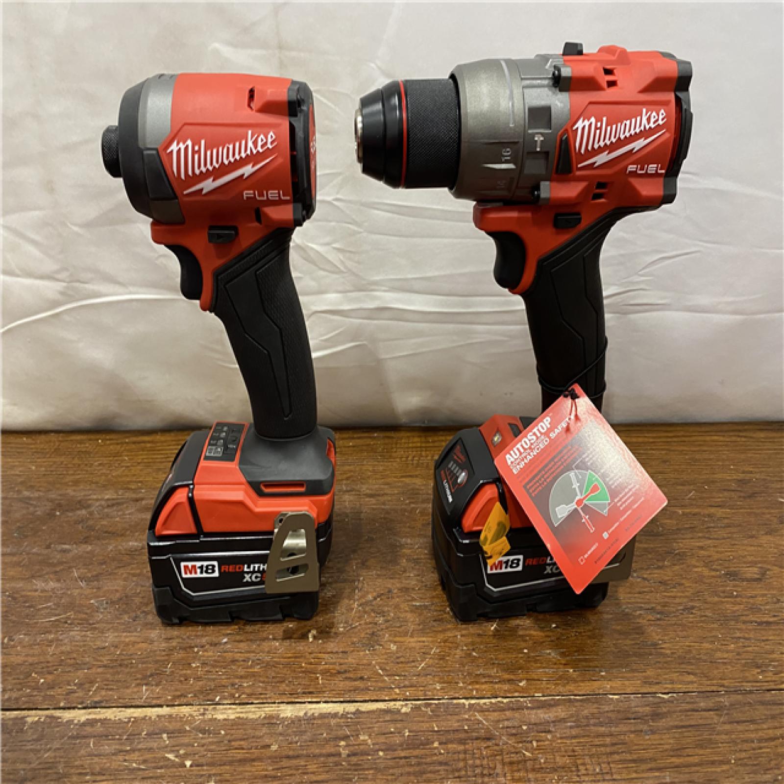 AS-IS MILWAUKEE M18 FUEL 18V Lithium-Ion Brushless Cordless Hammer Drill and Impact Driver Combo Kit (2-Tool) with 2 Batteries