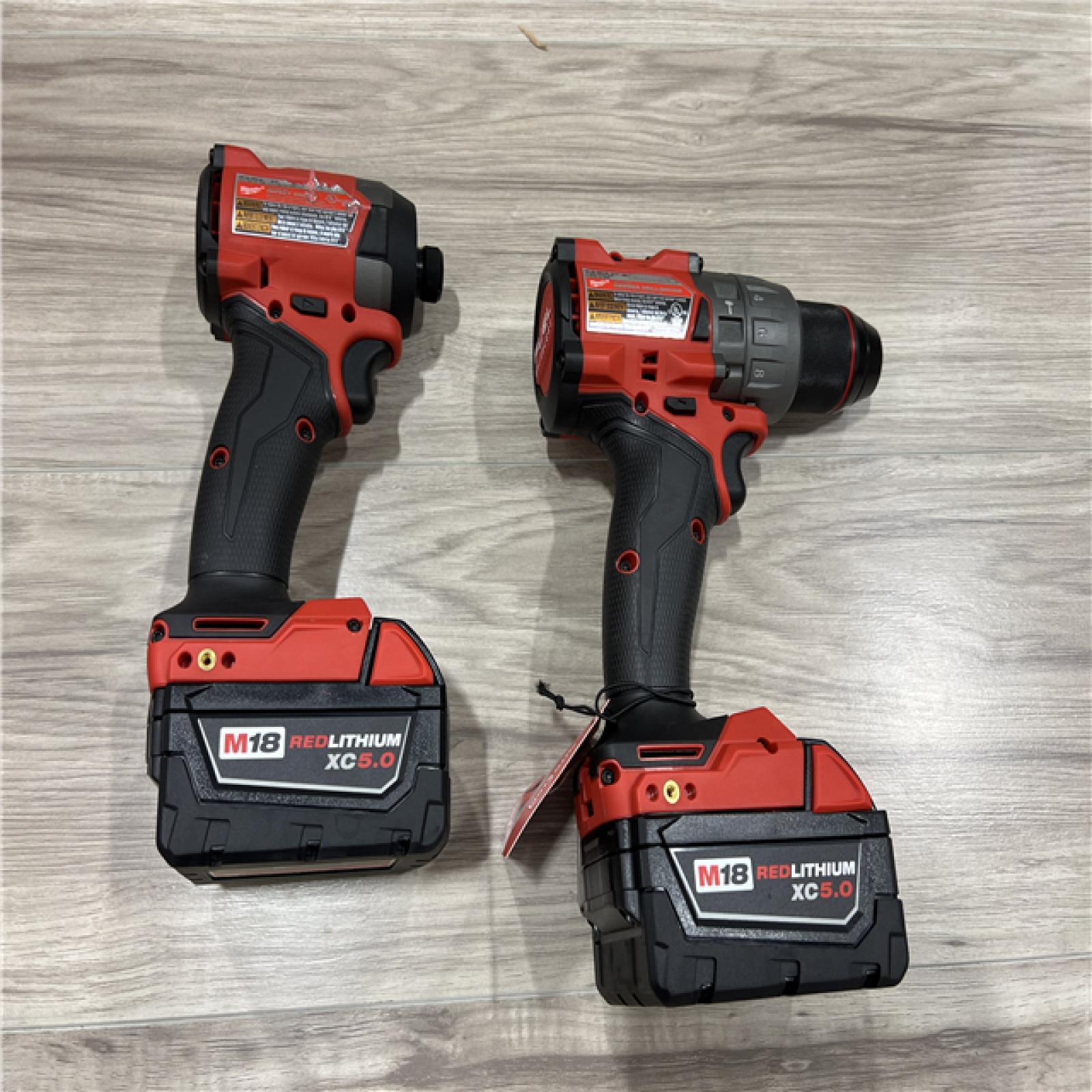 AS-IS Milwaukee FUEL 18V Lithium-Ion Brushless Cordless Hammer Drill and Impact Driver Combo Kit