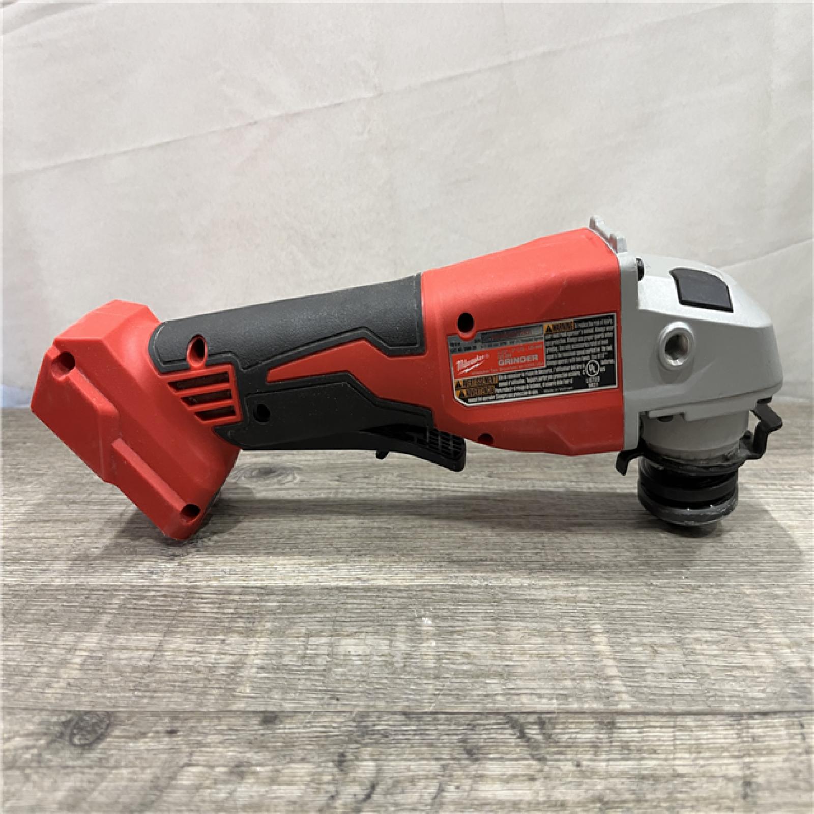 AS-IS Milwaukee 18V Lithium-Ion Brushless Cordless 4-1/2 in./5 in. Grinder w/Paddle Switch (Tool-Only)