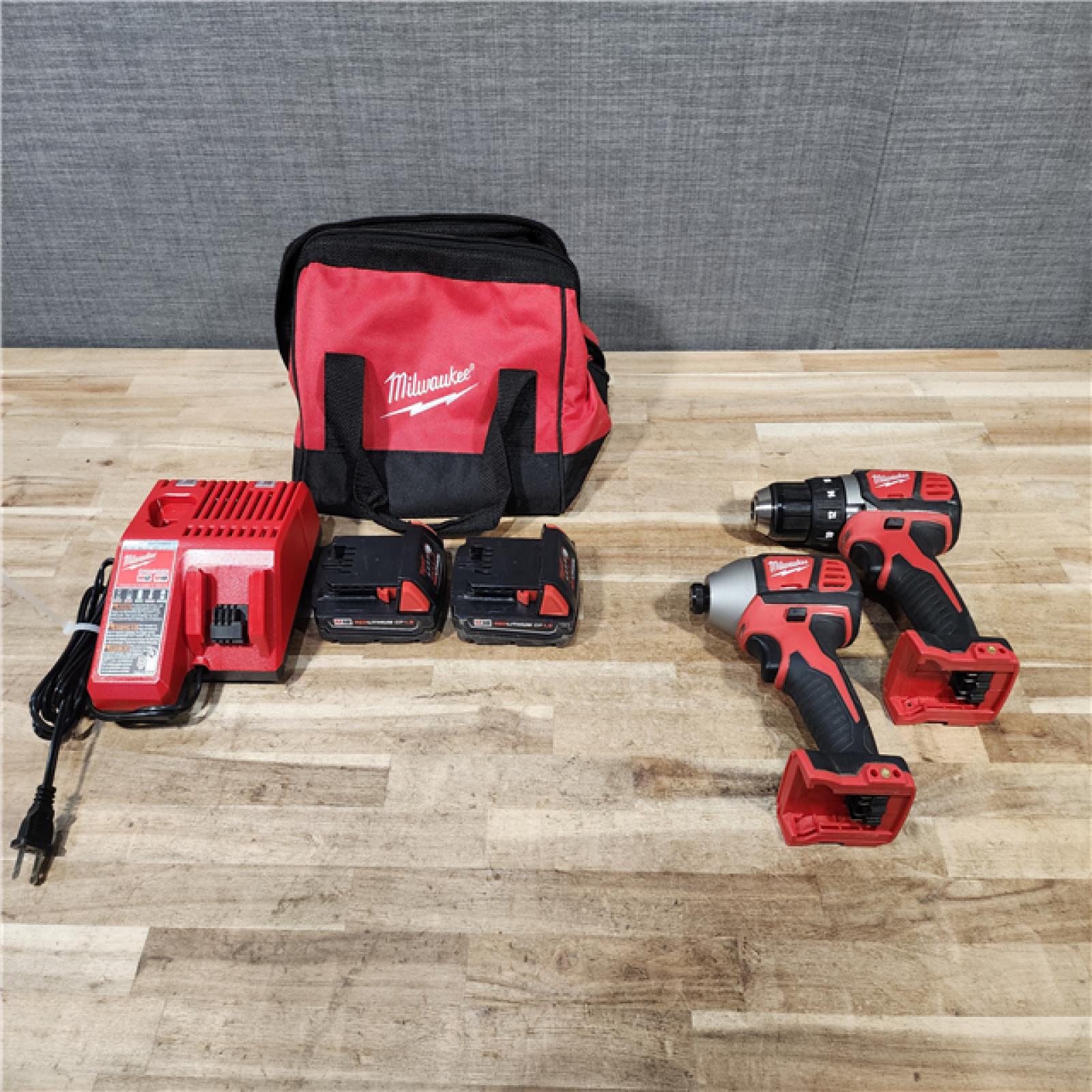 HOUSTON LOCATION - AS-IS Milwaukee 18V Lithium-Ion Cordless Drill Driver/Impact Driver Combo Kit