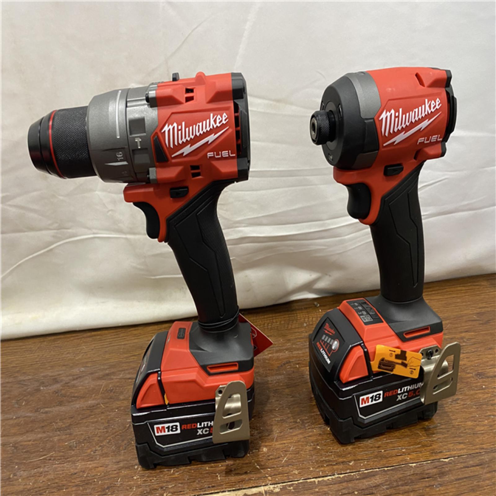 AS-IS MILWAUKEE M18 FUEL 18V Lithium-Ion Brushless Cordless Hammer Drill and Impact Driver Combo Kit (2-Tool) with 2 Batteries