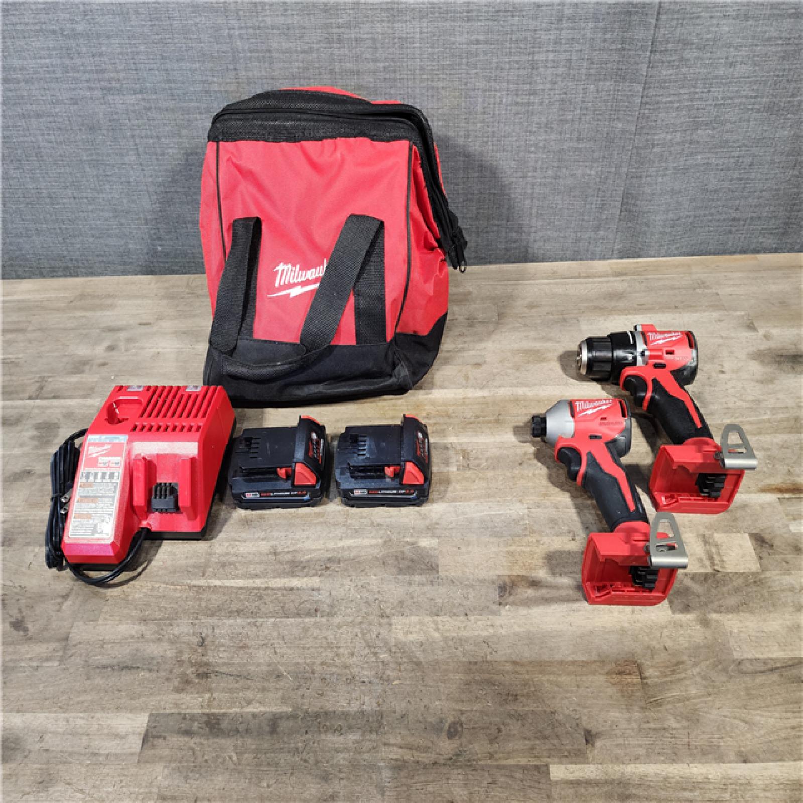 HOUSTON LOCATION - AS-IS Milwaukee M18 18V Lithium-Ion Brushless Cordless Compact Drill/Impact Combo Kit (2-Tool) W/(2) 2.0 Ah Batteries  Charger & Bag
