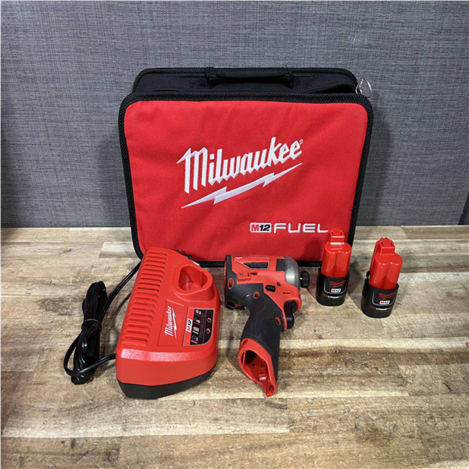 Houston Location AS-IS Milwaukee FUEL SURGE 12V Lithium-Ion Brushless Cordless 1/4 in. Hex Impact Driver Compact Kit