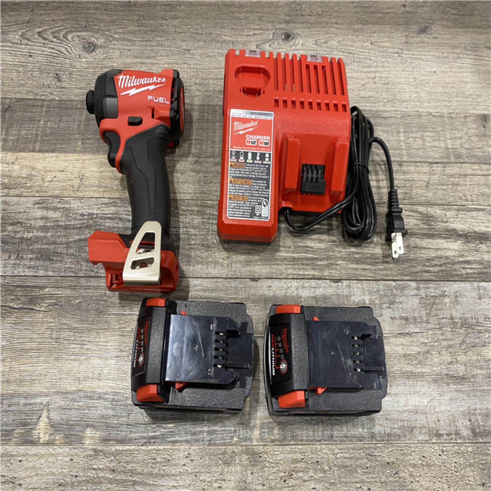 AS-IS Milwaukee FUEL 18V Lithium-Ion Brushless Cordless 1/4 in. Hex Impact Driver Kit