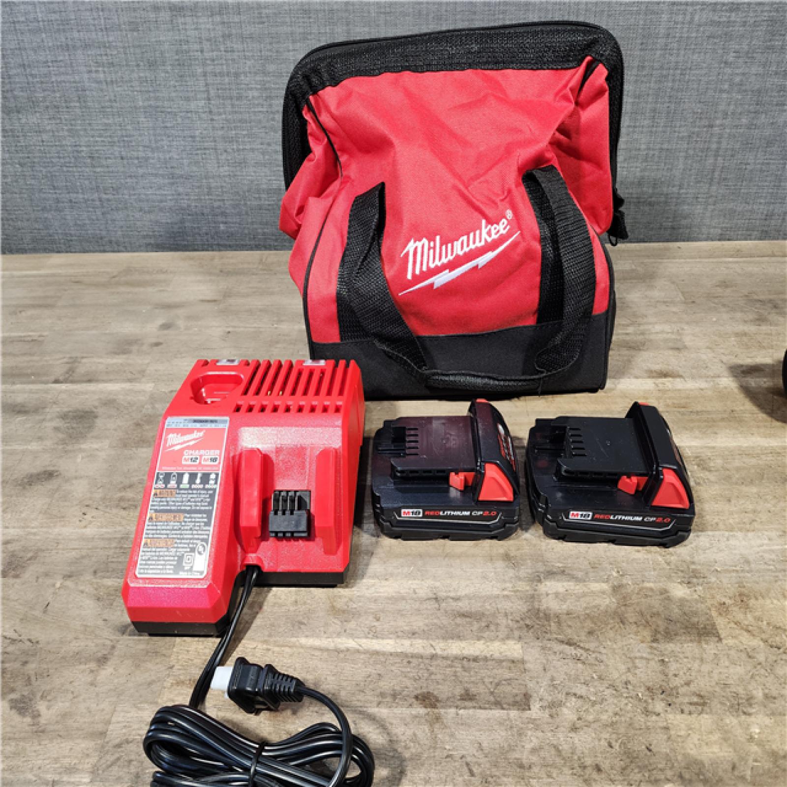 HOUSTON LOCATION - AS-IS Milwaukee M18 18V Lithium-Ion Brushless Cordless Compact Drill/Impact Combo Kit (2-Tool) W/(2) 2.0 Ah Batteries  Charger & Bag