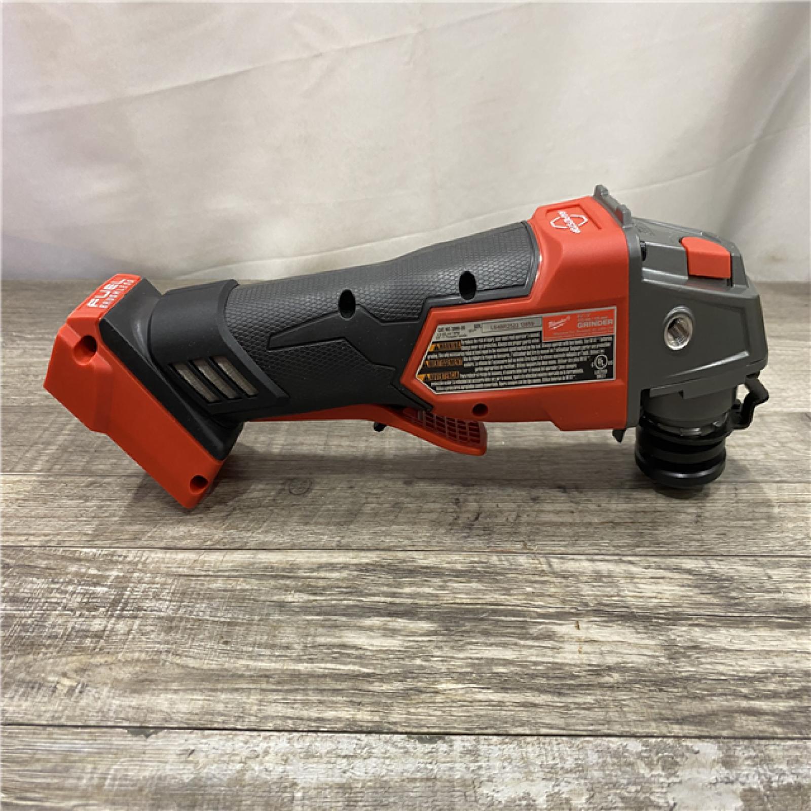 AS-IS Milwaukee FUEL 18V Lithium-Ion Brushless Cordless 4-1/2 in./5 in. Grinder w/Paddle Switch (Tool-Only)