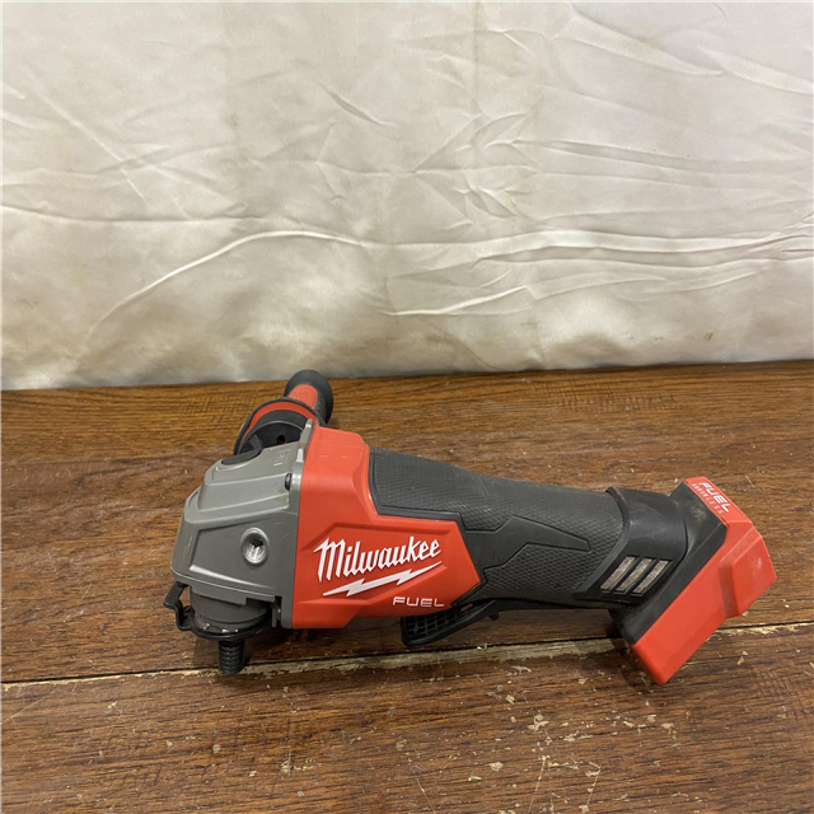 AS-IS Milwaukee 2880-20 M18 FUEL 18-Volt Lithium-Ion Brushless Cordless 4-1/2 in./5 in. Grinder W/Paddle Switch (Tool-Only)