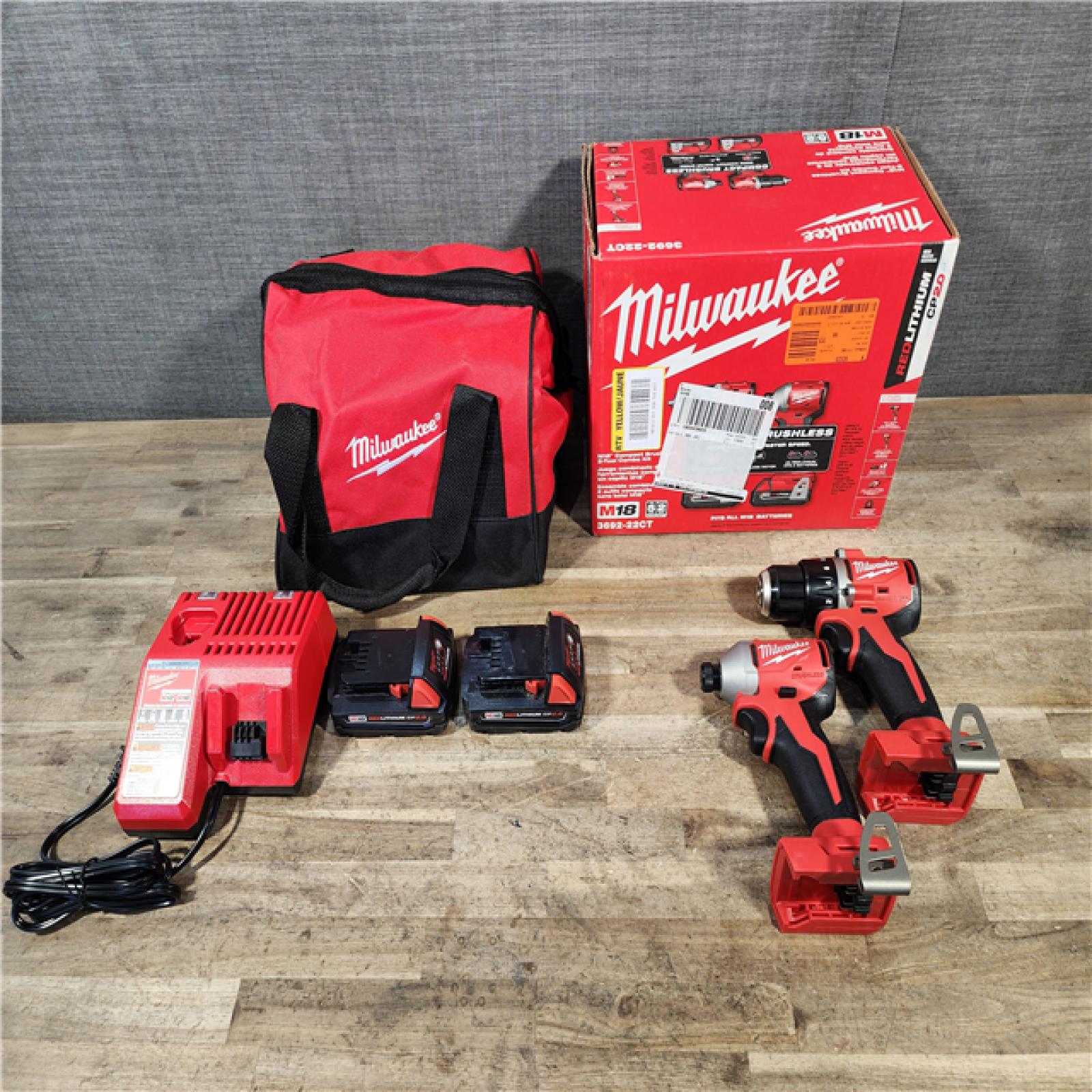HOUSTON LOCATION - AS-IS Milwaukee M18 18V Lithium-Ion Brushless Cordless Compact Drill/Impact Combo Kit (2-Tool) W/(2) 2.0 Ah Batteries  Charger & Bag