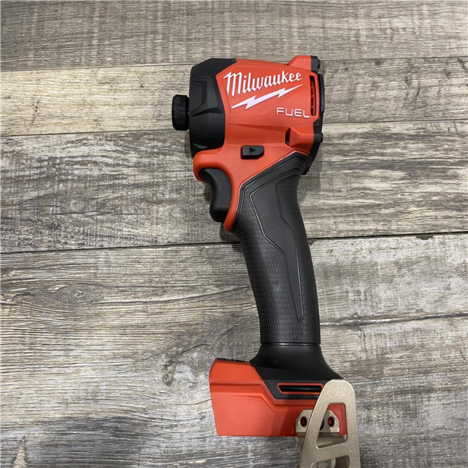 AS-IS Milwaukee FUEL SURGE 18V Lithium-Ion Brushless Cordless 1/4 in. Hex Impact Driver with (2) 5.0 Ah Battery and Charger