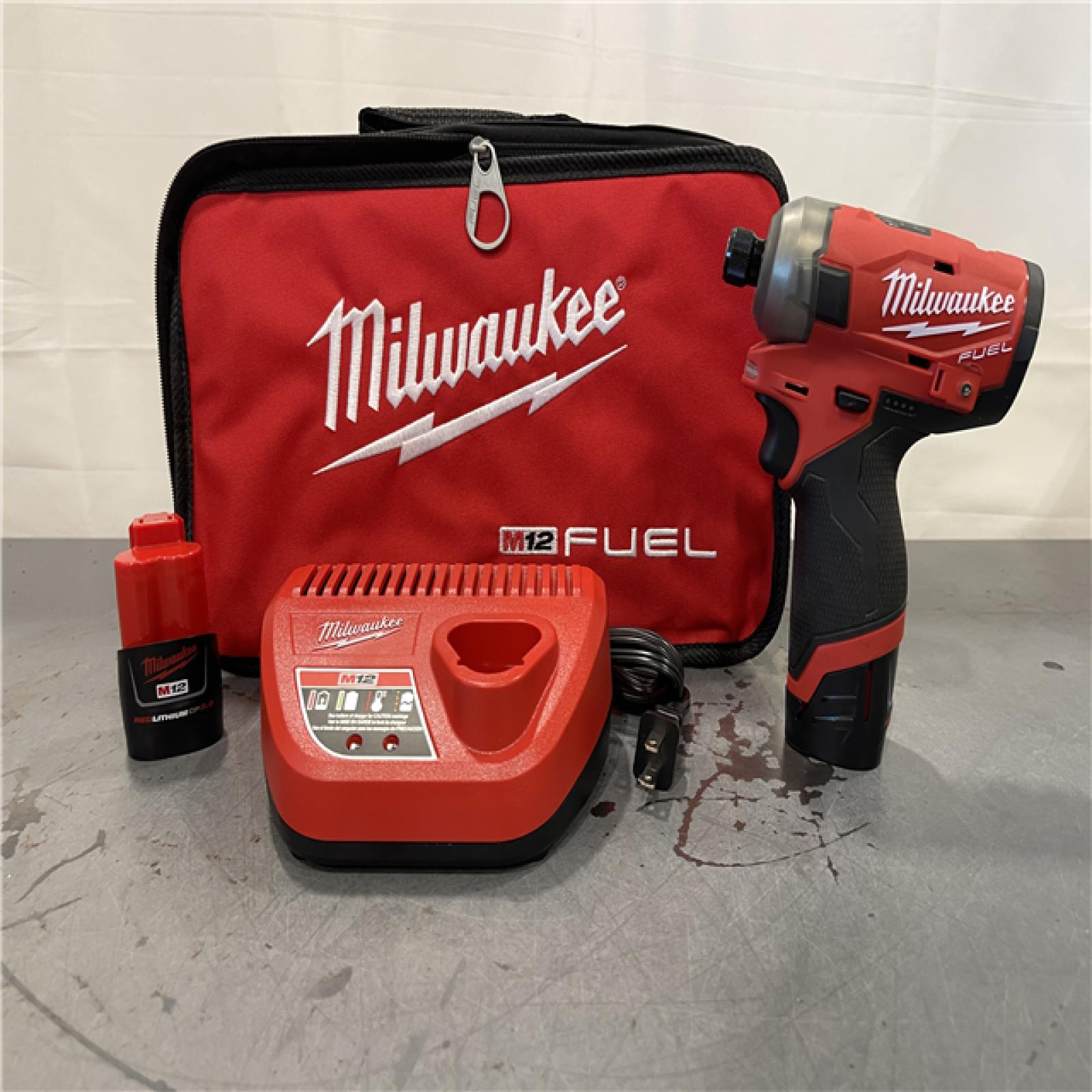 AS-IS - Milwaukee M12 FUEL SURGE 12V Lithium-Ion Brushless Cordless 1/4 in. Hex Impact Driver Compact Kit