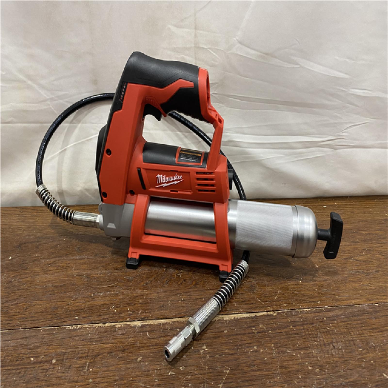 AS-IS Milwaukee Tool 10,000 PSI 14 Oz Battery-Operated Grease Gun - 48 Flexible Hose, 31 Strokes/oz | Part #2646-20