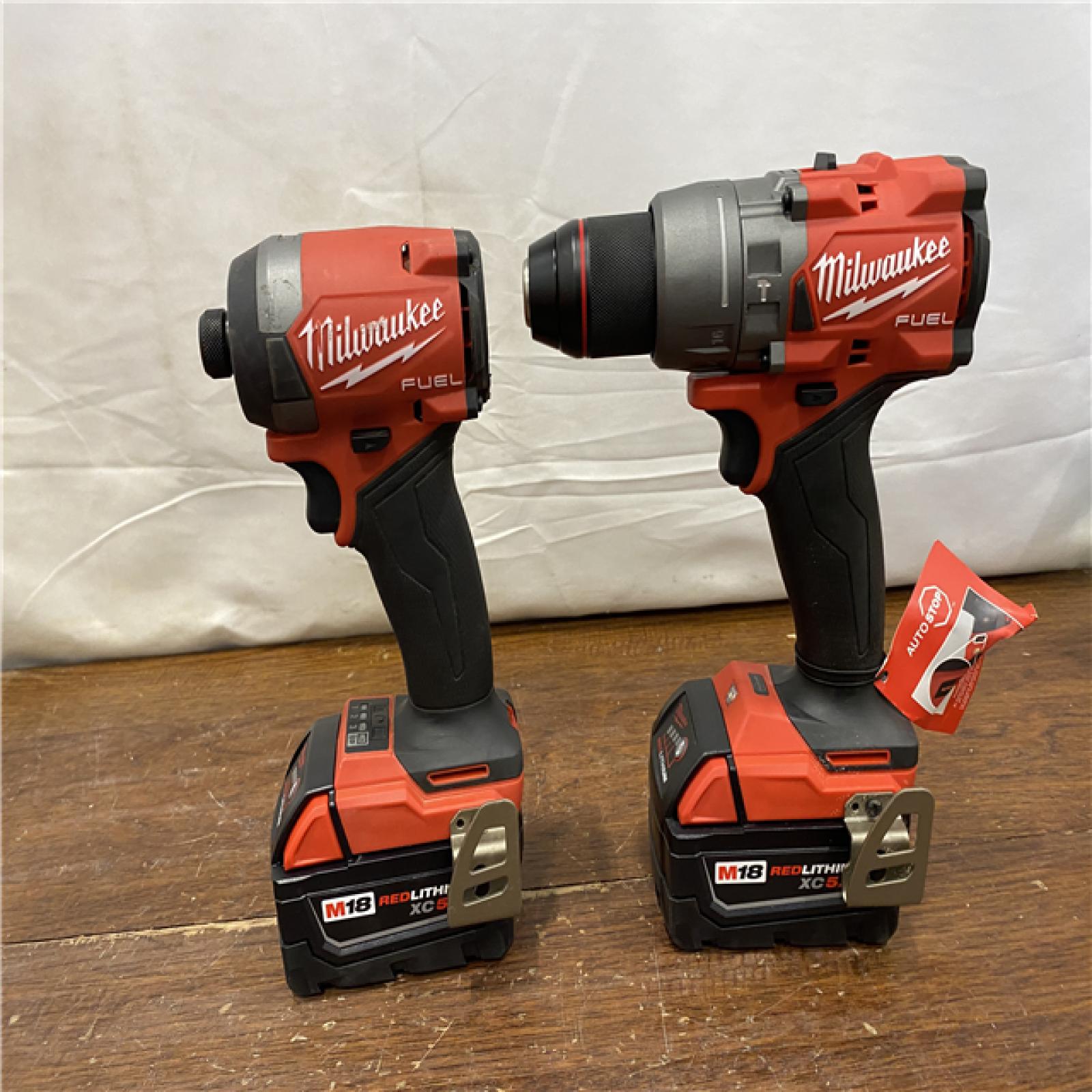 AS-IS MILWAUKEE M18 FUEL 18V Lithium-Ion Brushless Cordless Hammer Drill and Impact Driver Combo Kit (2-Tool) with 2 Batteries