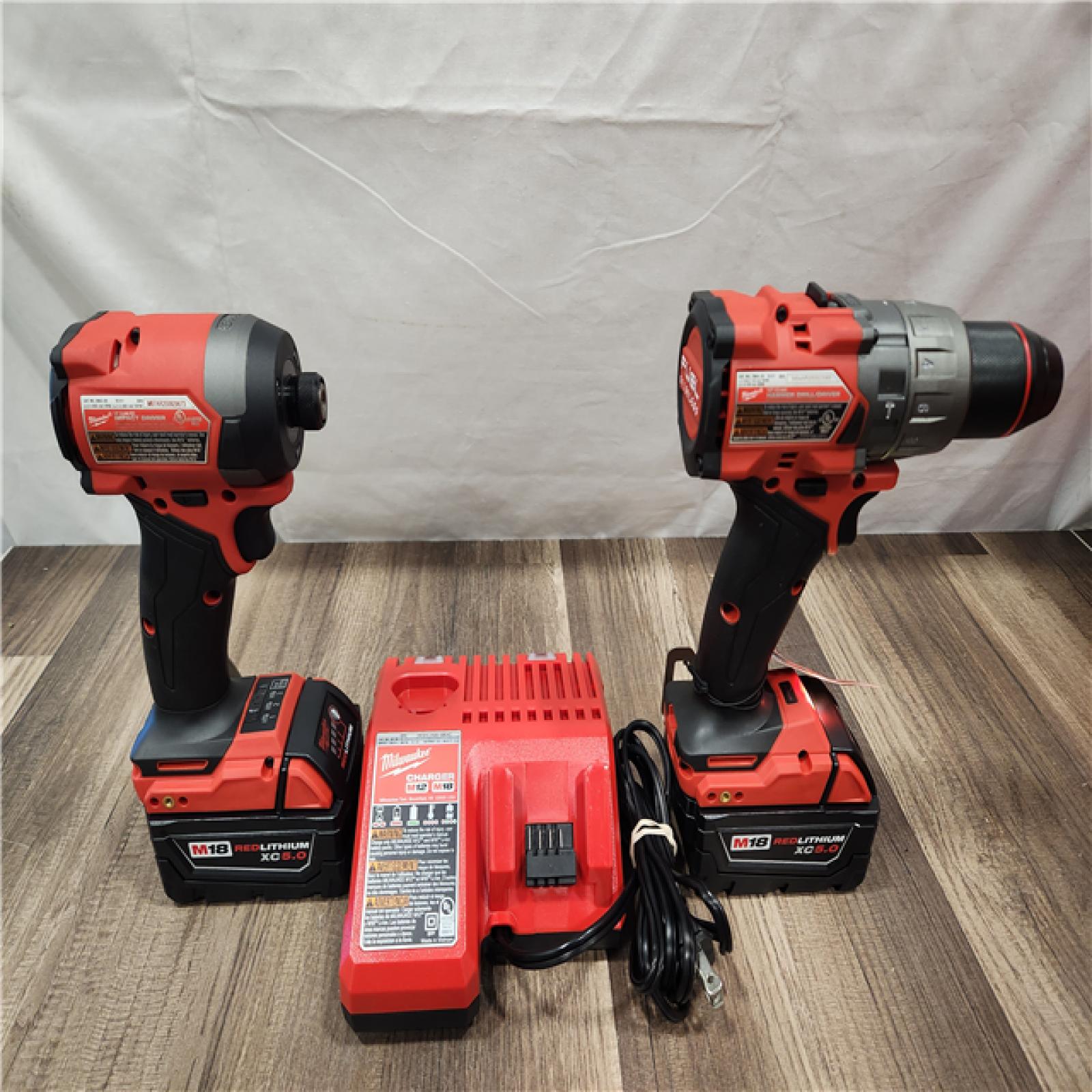 AS-IS- MILWAUKEE FUEL 18V Lithium-Ion Brushless Cordless Hammer Drill and Impact Driver Combo Kit