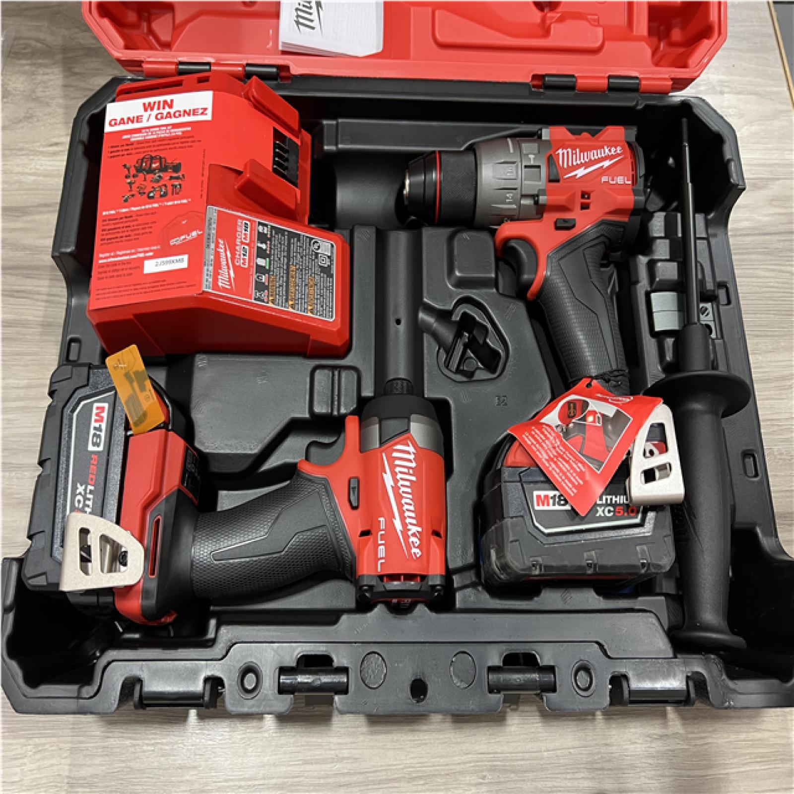 AS-IS Milwaukee FUEL 18V Lithium-Ion Brushless Cordless Hammer Drill and Impact Driver Combo Kit