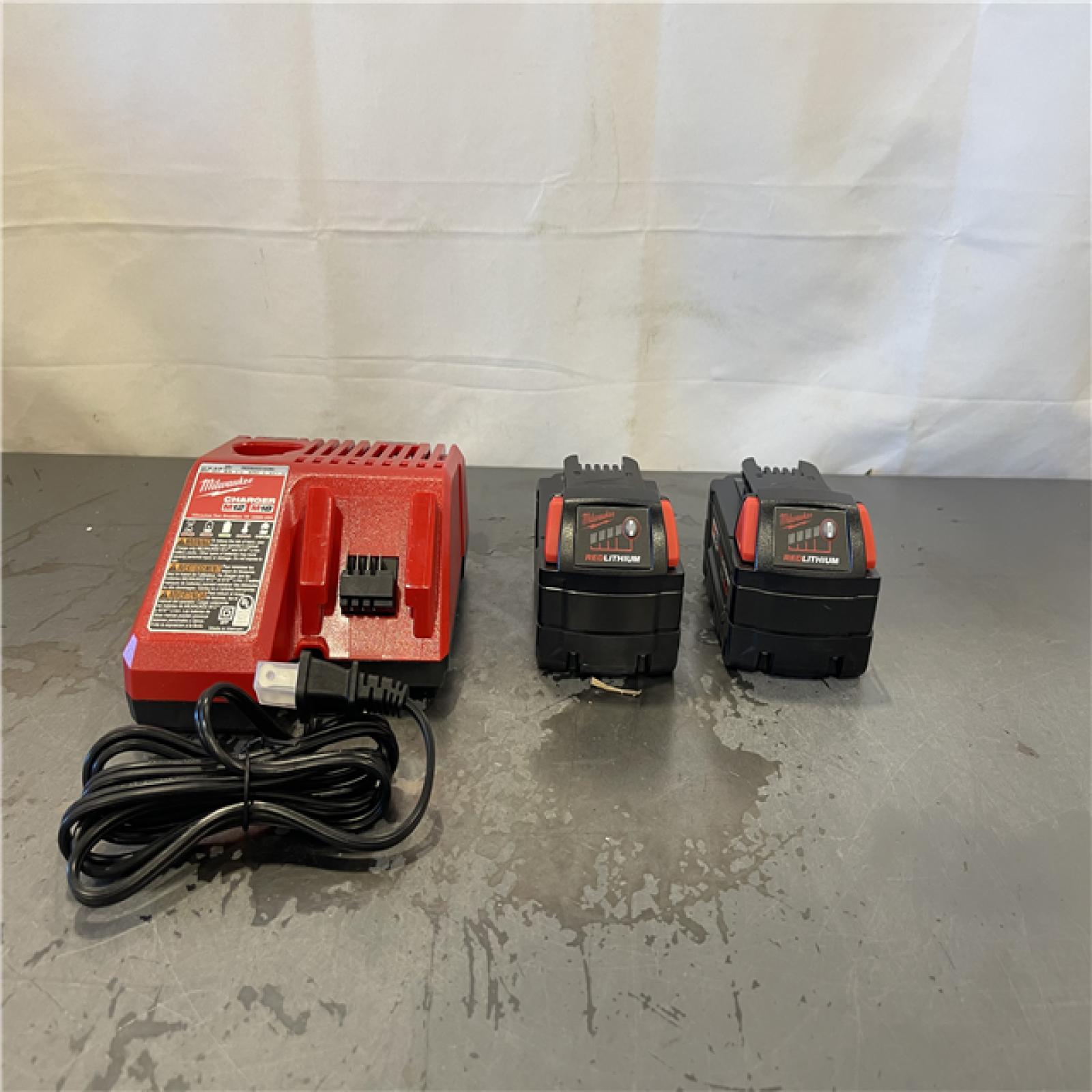 AS-IS- M18 18-Volt Lithium-Ion XC Starter Kit with Two 5.0Ah Batteries and Charger