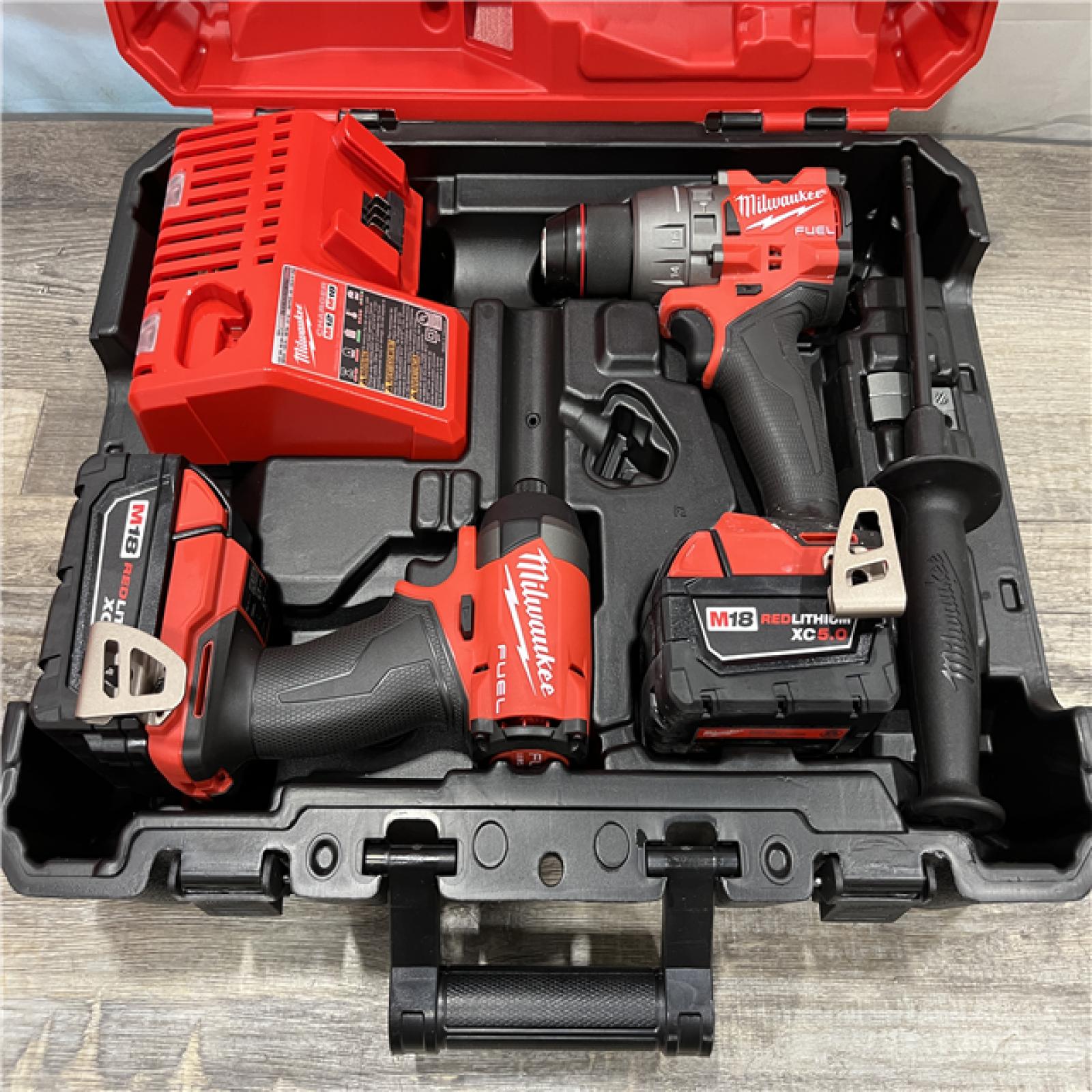 AS-IS Milwaukee FUEL 18V Lithium-Ion Brushless Cordless Hammer Drill and Impact Driver Combo Kit