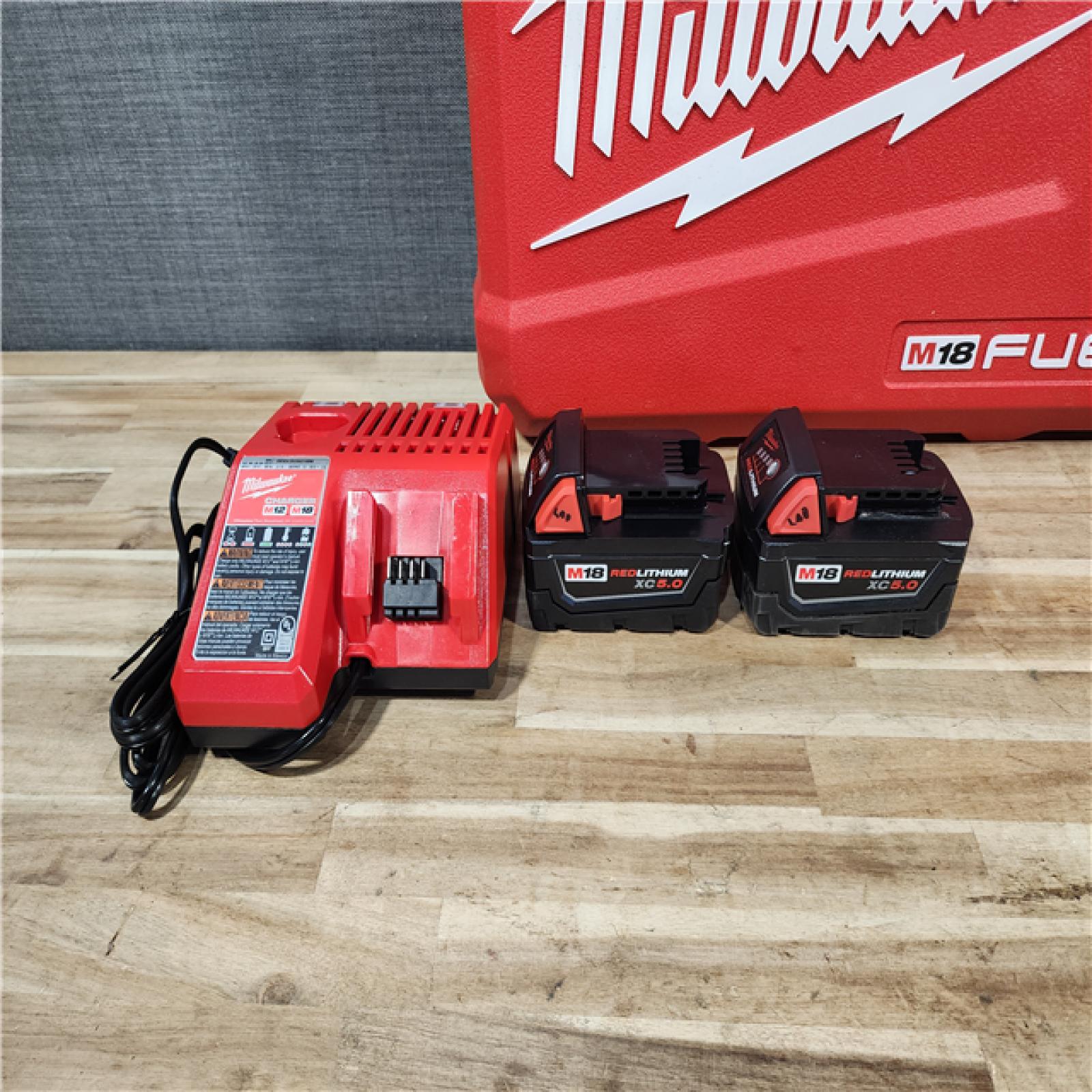 HOUSTON LOCATION - AS-IS Milwaukee FUEL 18V Lithium-Ion Brushless Cordless Hammer Drill and Impact Driver Combo Kit