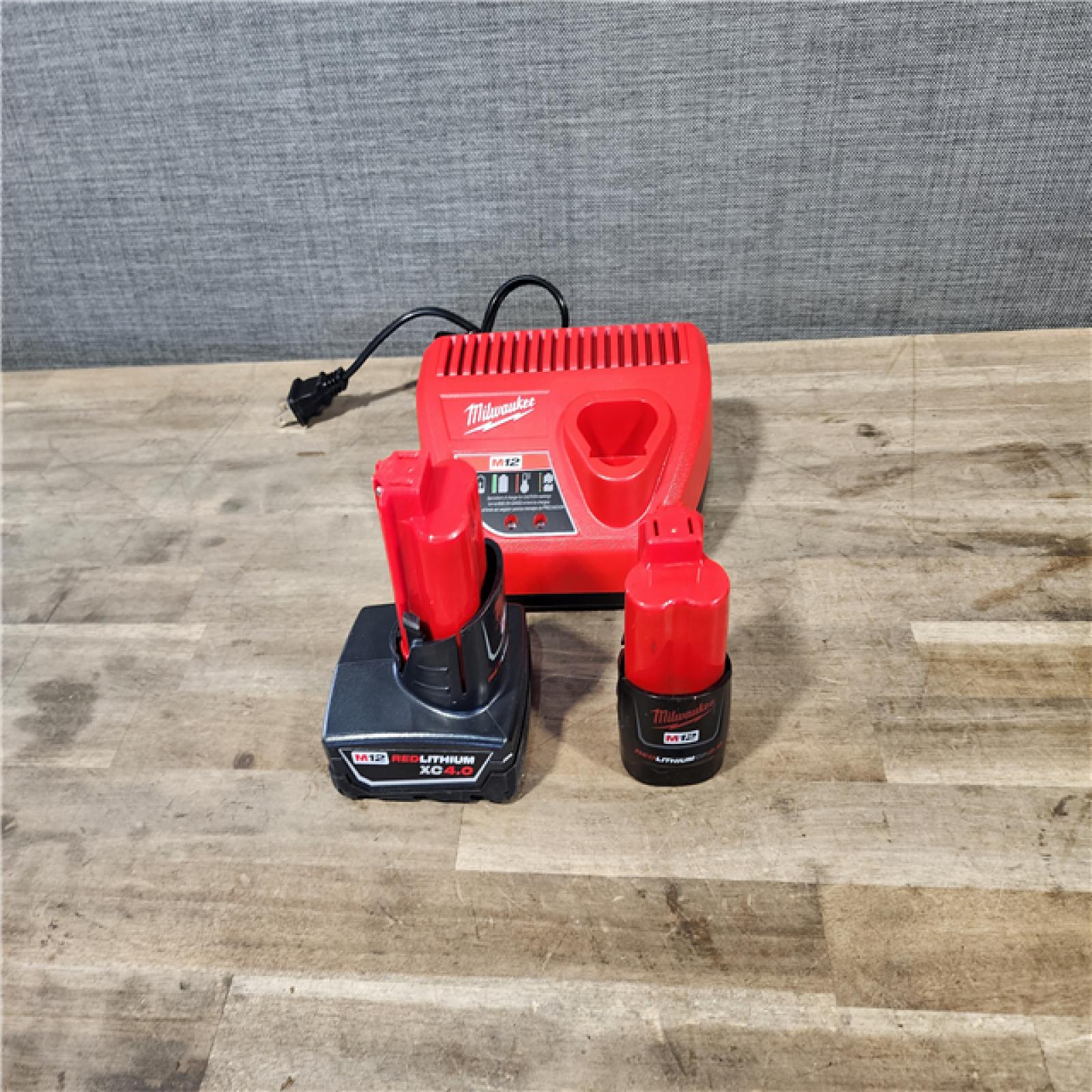 HOUSTON LOCATION - AS-IS MILWAUKEE 4 TOOL COMBO KIT W/ (2) BATTERY & CHARGER