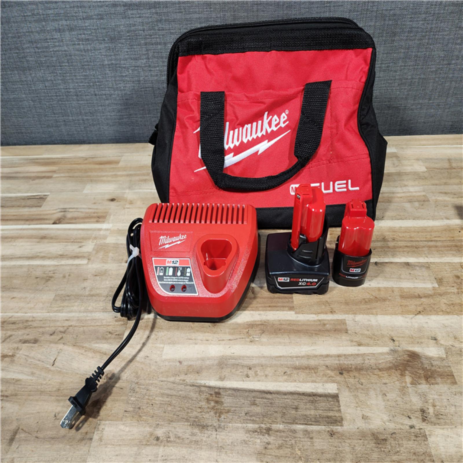 HOUSTON LOCATION - AS-IS Milwaukee  FUEL 12-Volt Lithium-Ion Brushless Cordless Hammer Drill and Impact Driver Combo Kit