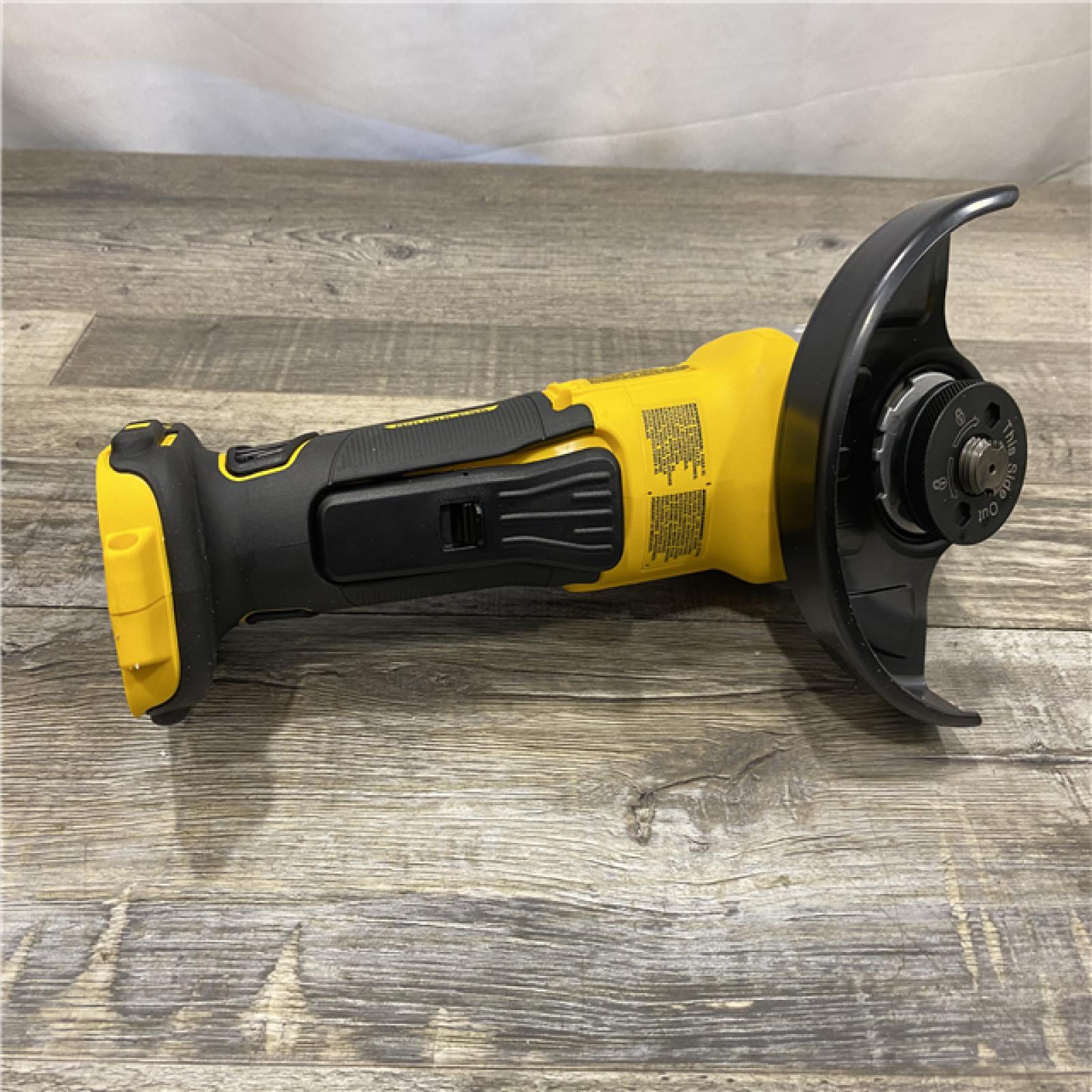 AS-IS DEWALT 20-Volt MAX XR Lithium-Ion Cordless Brushless 4-1/2 in. Paddle Switch Small Angle Grinder w/ Kickback Brake (Tool-Only)