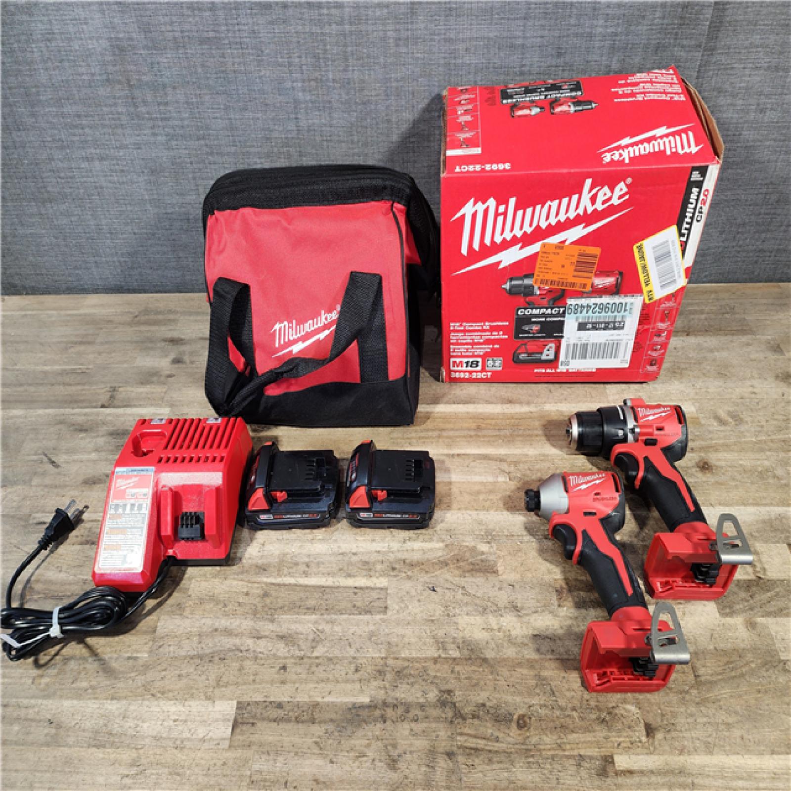 HOUSTON LOCATION - AS-IS Milwaukee M18 18V Lithium-Ion Brushless Cordless Compact Drill/Impact Combo Kit (2-Tool) W/(2) 2.0 Ah Batteries  Charger & Bag