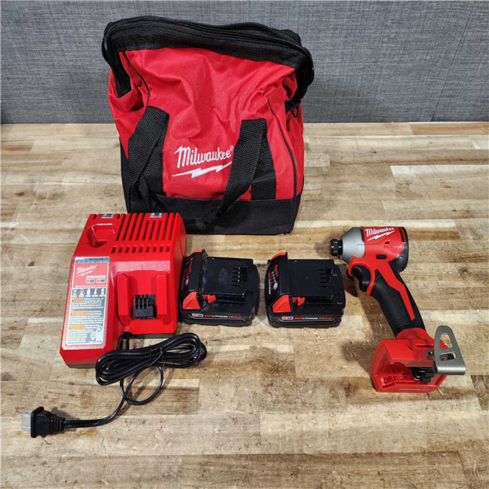 HOUSTON LOCATION - AS - IS Milwaukee 18V Lithium-Ion Brushless Cordless 1/4 in. Impact Driver Kit