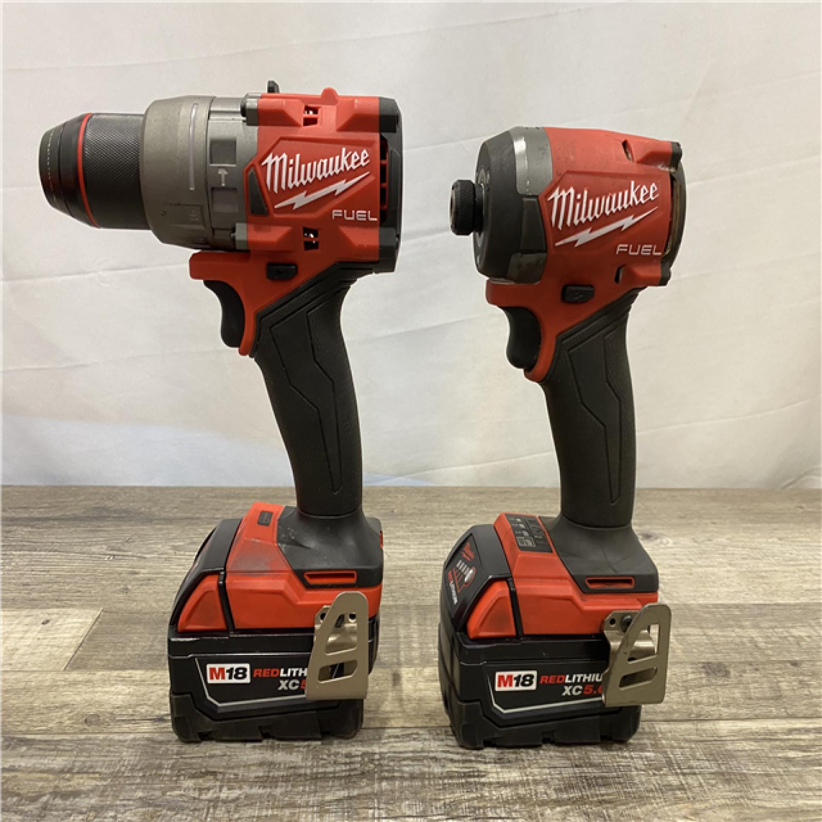 AS-IS Milwaukee FUEL 18V Lithium-Ion Brushless Cordless Hammer Drill and Impact Driver Combo Kit (2-Tool) with 2 Batteries