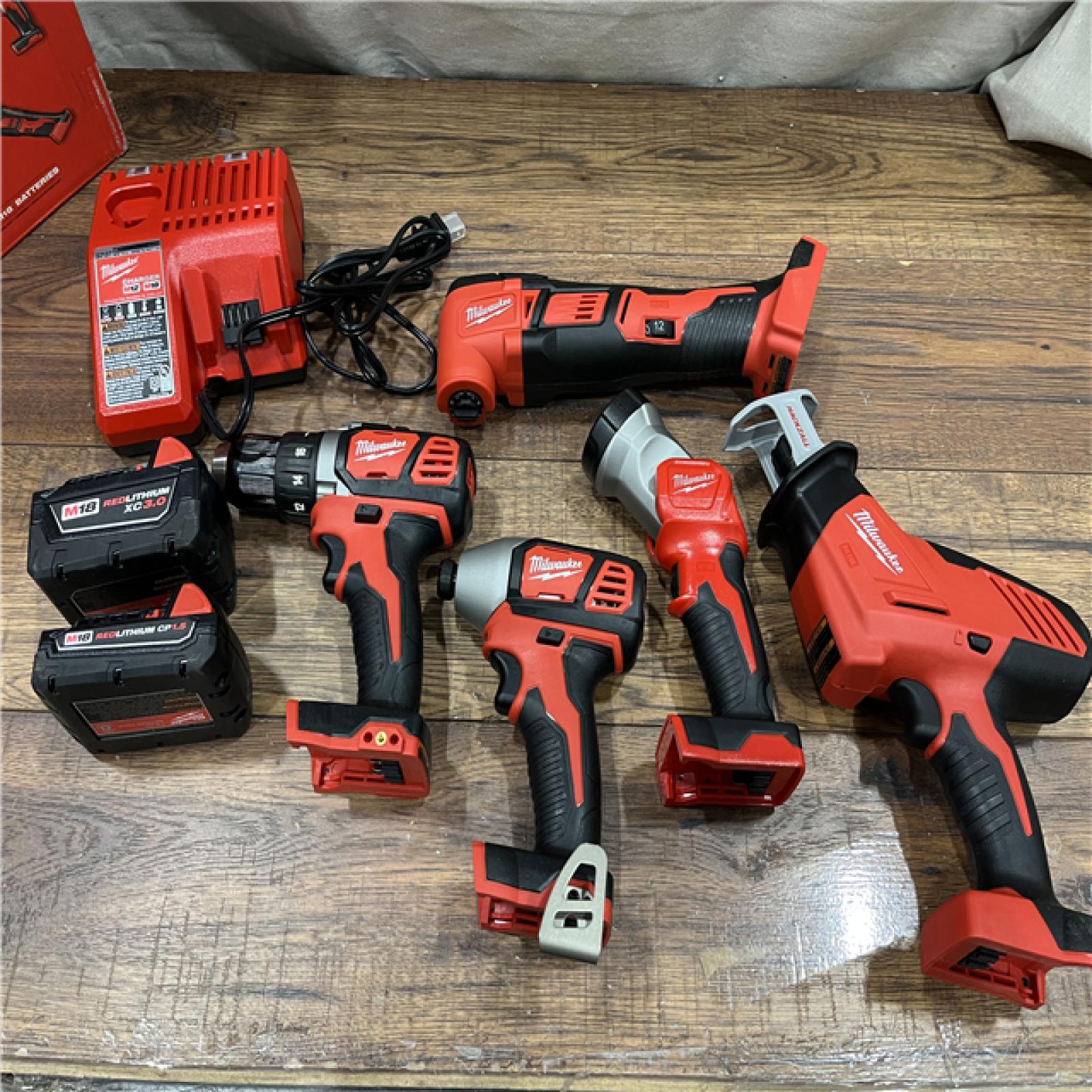 AS-IS Milwaukee M18 18V Lithium-Ion Cordless Combo Kit (5-Tool) with (2) Batteries, Charger and Tool Bag