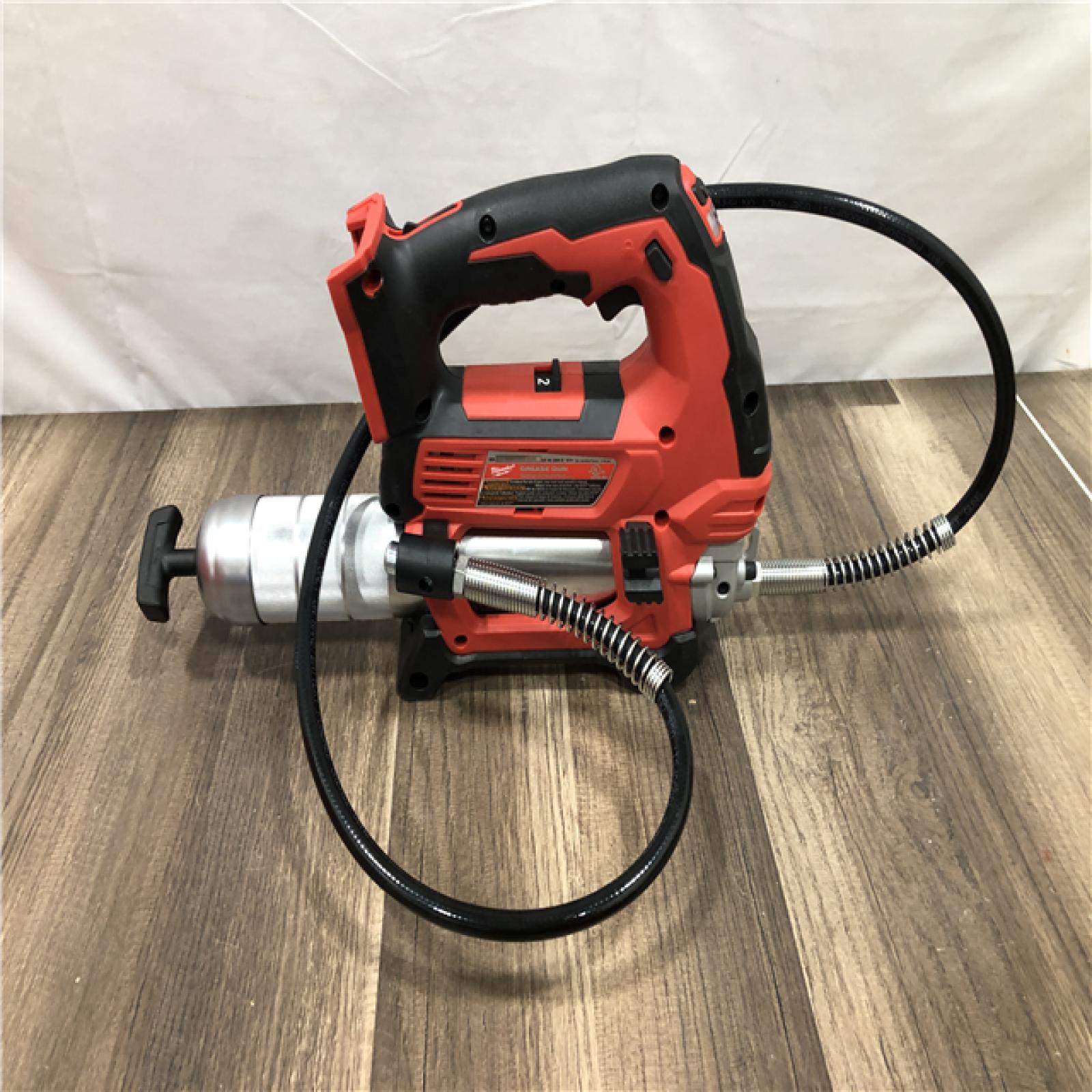 AS-IS Milwaukee 18V Lithium-Ion Cordless Grease Gun 2-Speed with (1) 1.5Ah Batteries  Charger  Tool Bag