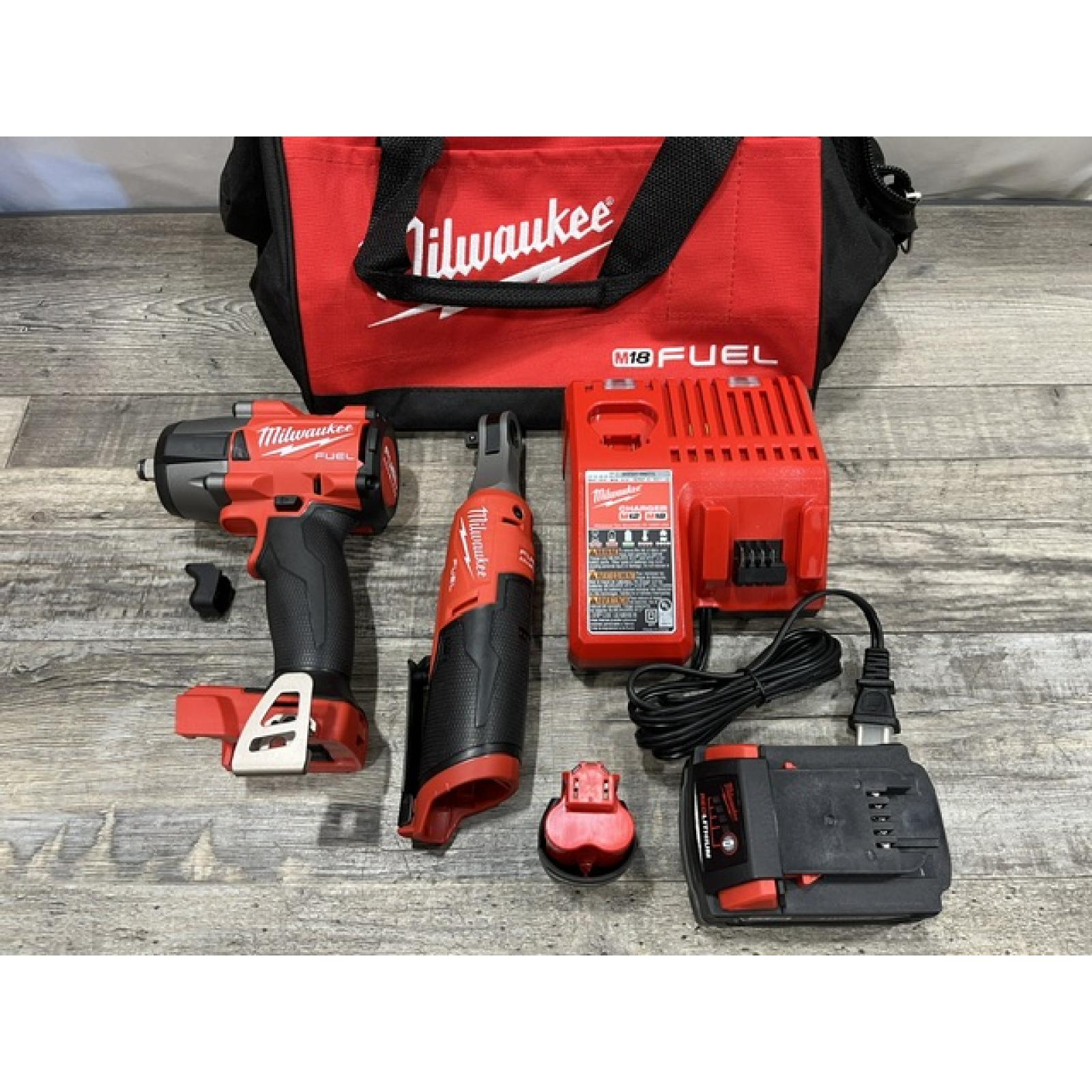 AS-IS Milwaukee FUEL 18V Cordless Mid Torque 1/2 in. Impact Wrench w/ 12 FUEL 3/8 in. Ratchet Combo Kit