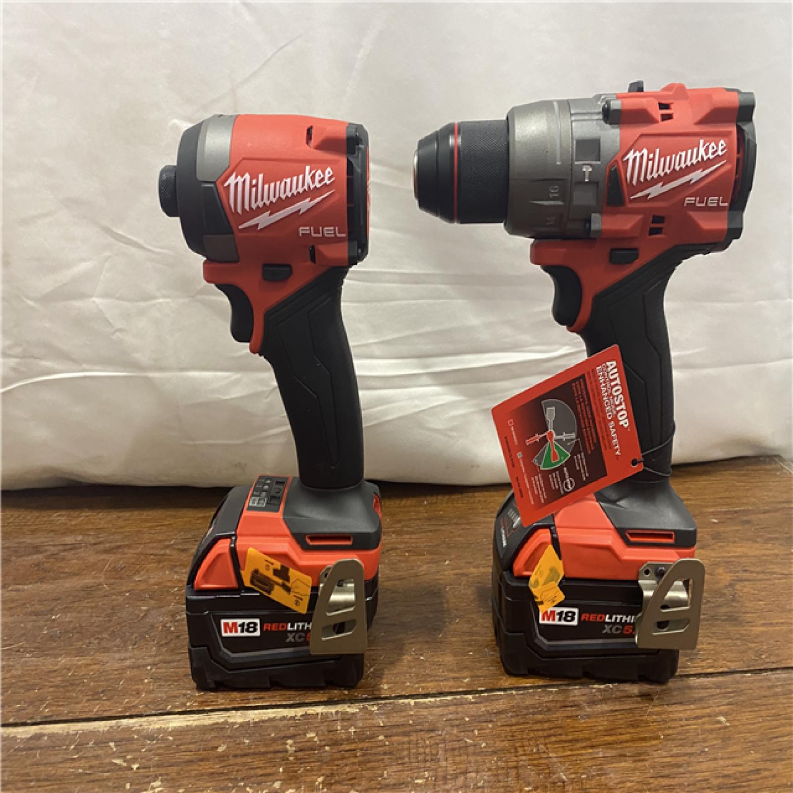 AS-IS MILWAUKEE M18 FUEL 18V Lithium-Ion Brushless Cordless Hammer Drill and Impact Driver Combo Kit (2-Tool) with 2 Batteries