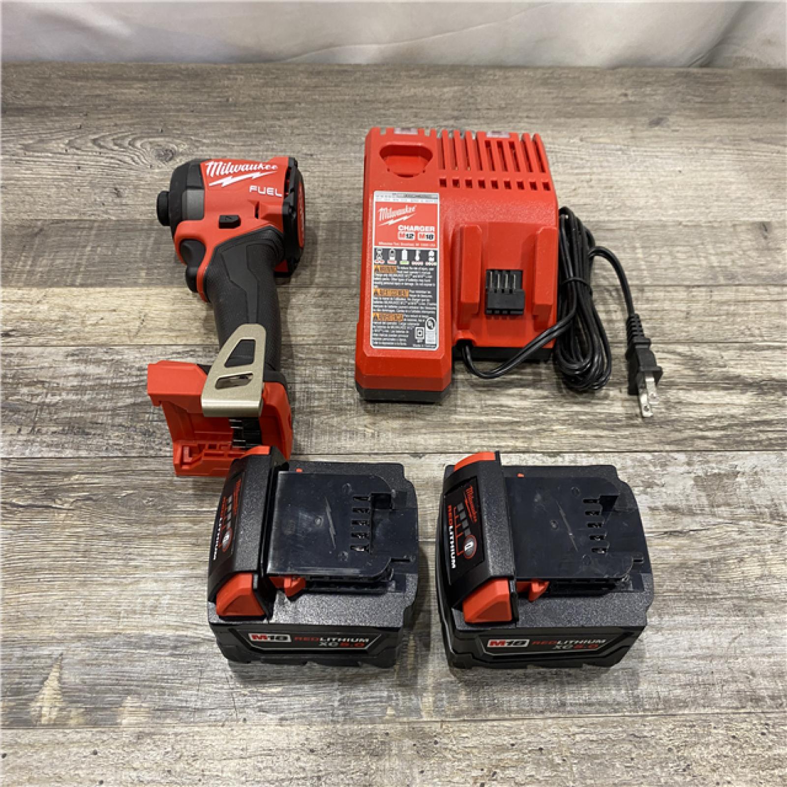 AS-IS Milwaukee FUEL 18V Lithium-Ion Brushless Cordless 1/4 in. Hex Impact Driver Kit