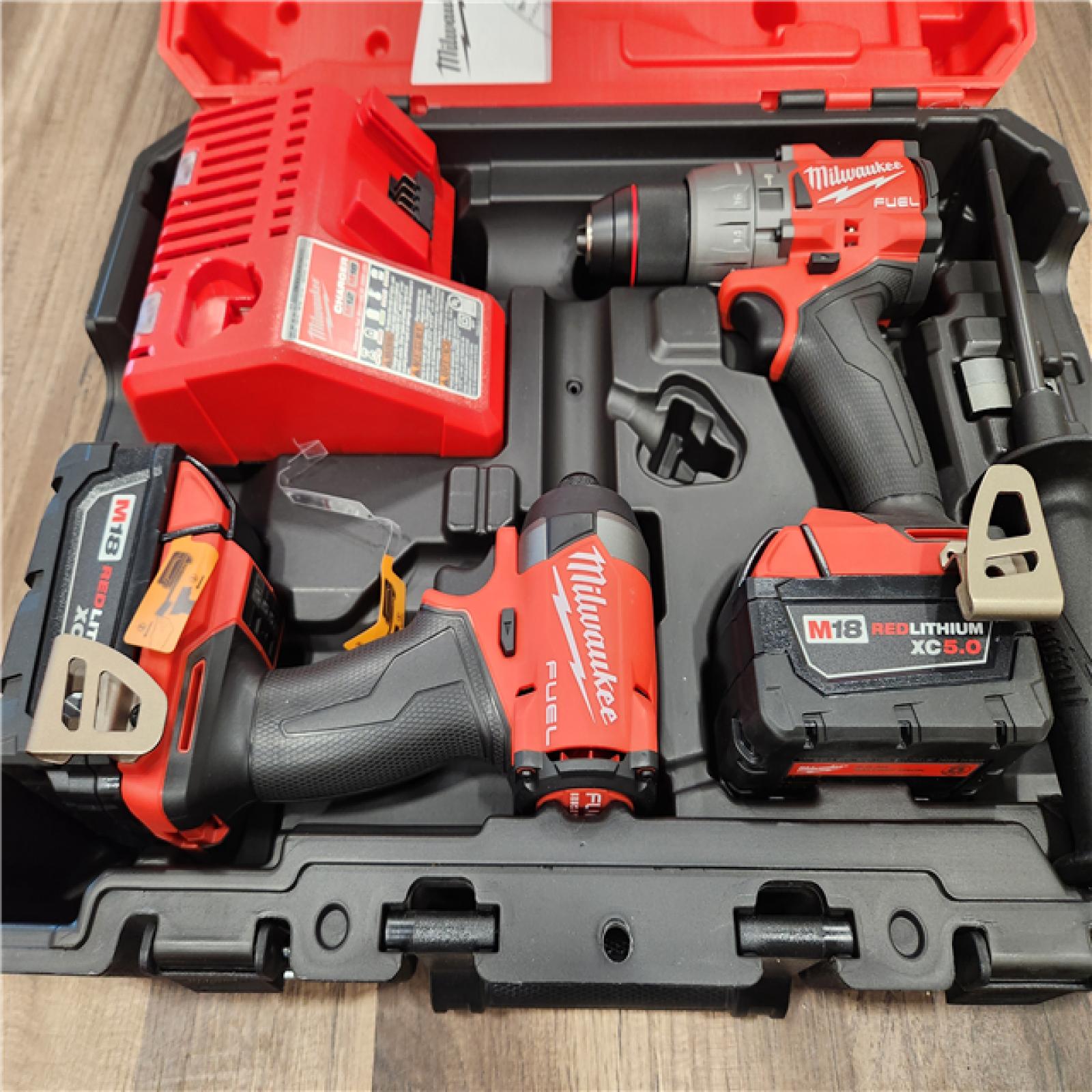 AS-IS  Milwaukee M18 FUEL 18V Lithium-Ion Brushless Cordless Hammer Drill and Impact Driver Combo Kit (2-Tool) with 2 Batteries
