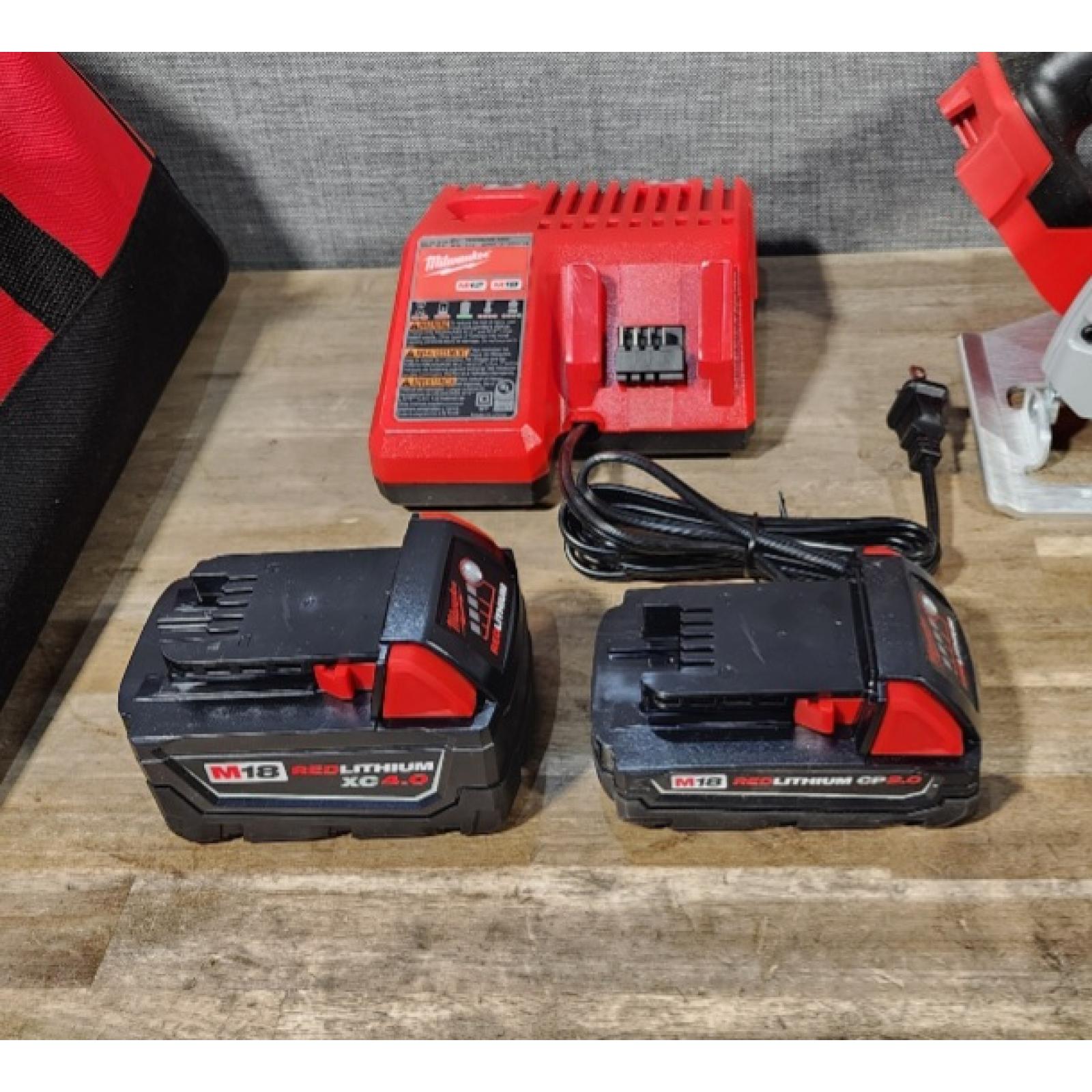 HOUSTON LOCATION - AS-IS Milwaukee M18 18-Volt Lithium-Ion Brushless Cordless Combo Kit (4-Tool) with 2-Batteries  1-Charger and Tool Bag