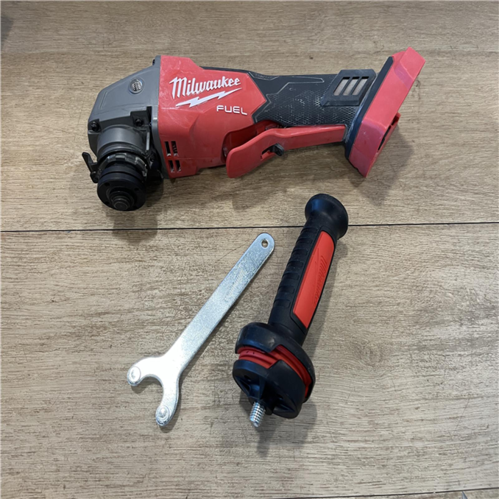 AS-IS Milwaukee FUEL 18V Lithium-Ion Brushless Cordless 4-1/2 in./5 in. Grinder w/Paddle Switch (Tool-Only)