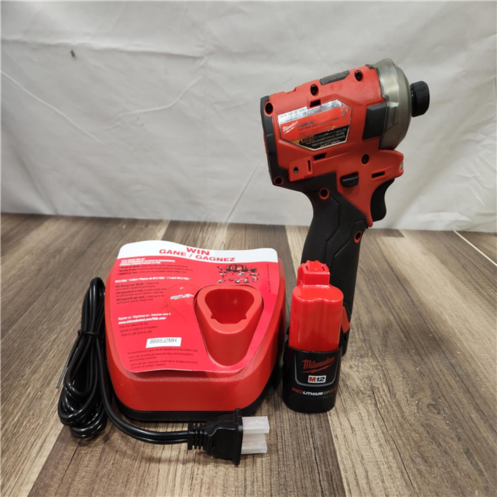 AS-IS- Milwaukee M12 FUEL SURGE 12V Lithium-Ion Brushless Cordless 1/4 in. Hex Impact Driver Compact Kit W/Two 2.0Ah Batteries  Bag