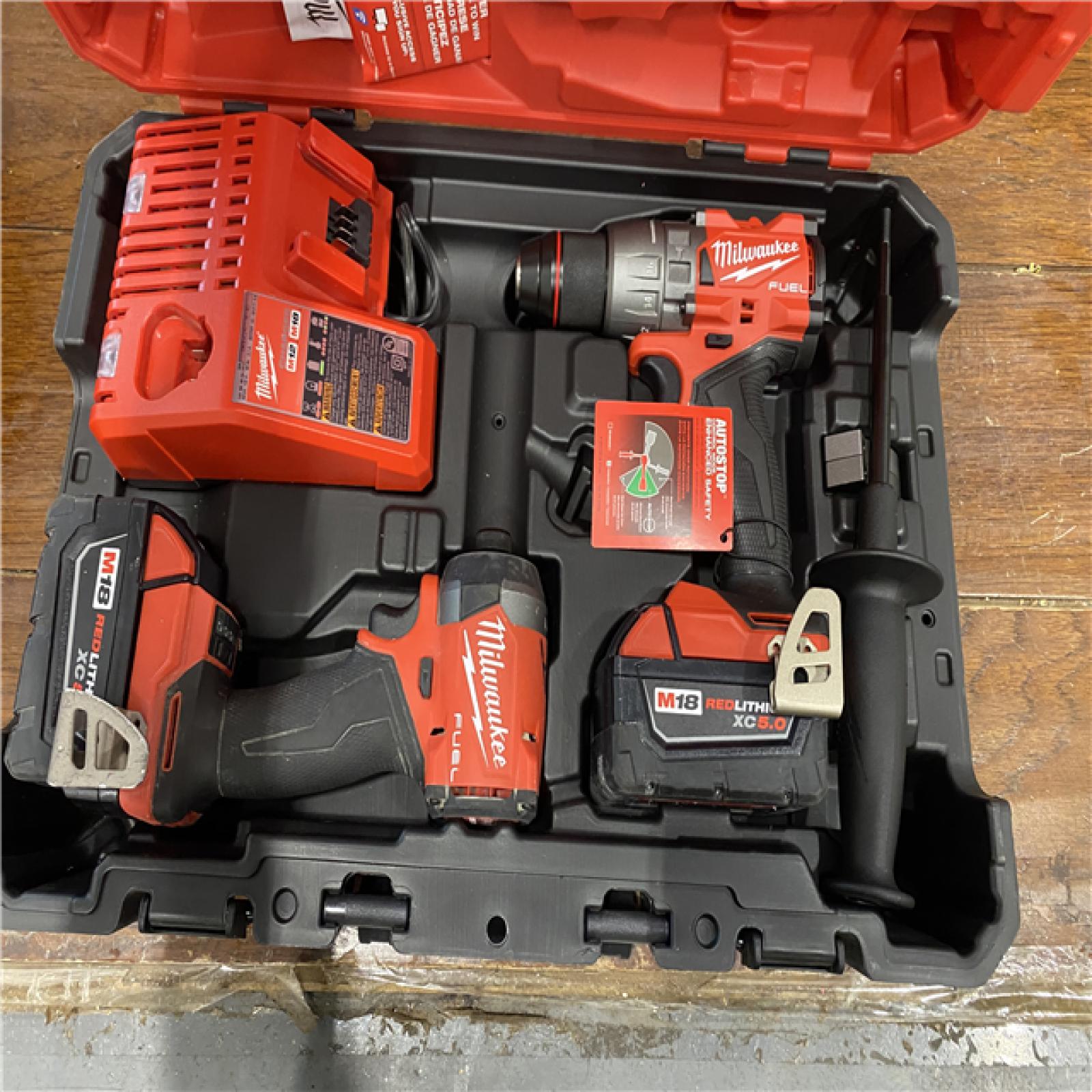 AS-IS MILWAUKEE M18 FUEL 18V Lithium-Ion Brushless Cordless Hammer Drill and Impact Driver Combo Kit (2-Tool) with 2 Batteries