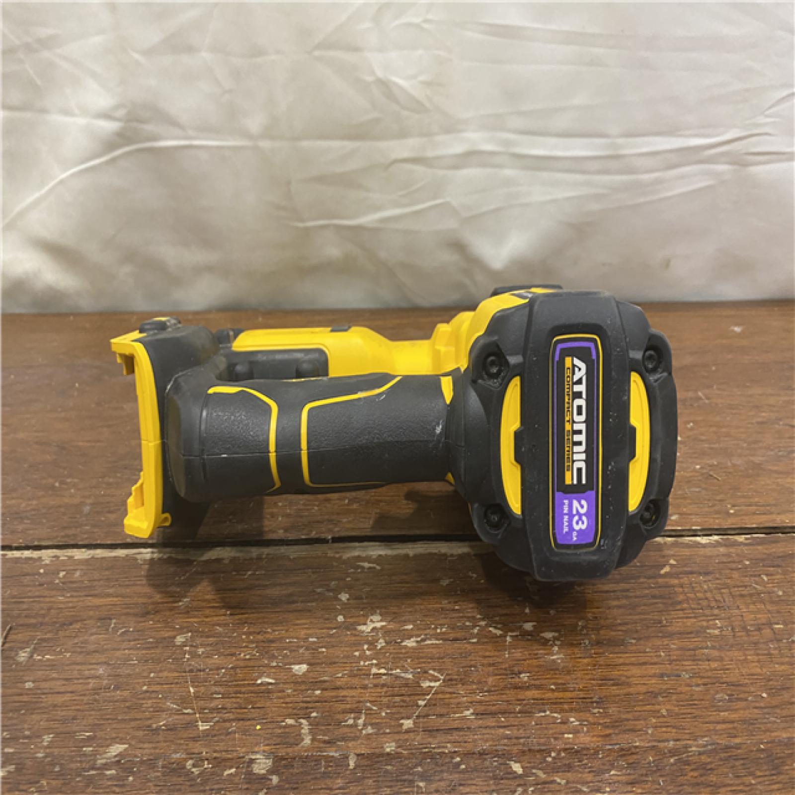 AS-IS DEWALT ATOMIC 20V MAX Lithium Ion Cordless 23 Gauge Pin Nailer Kit with 3.0Ah Battery and Charger