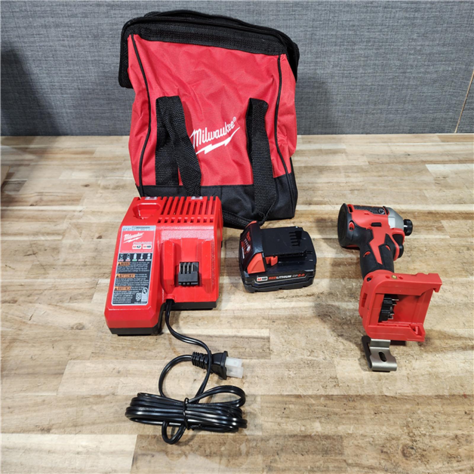 HOUSTON LOCATION - AS - IS Milwaukee 18-Volt Lithium-Ion Compact Brushless Cordless 1/4 in. Impact Driver Kit