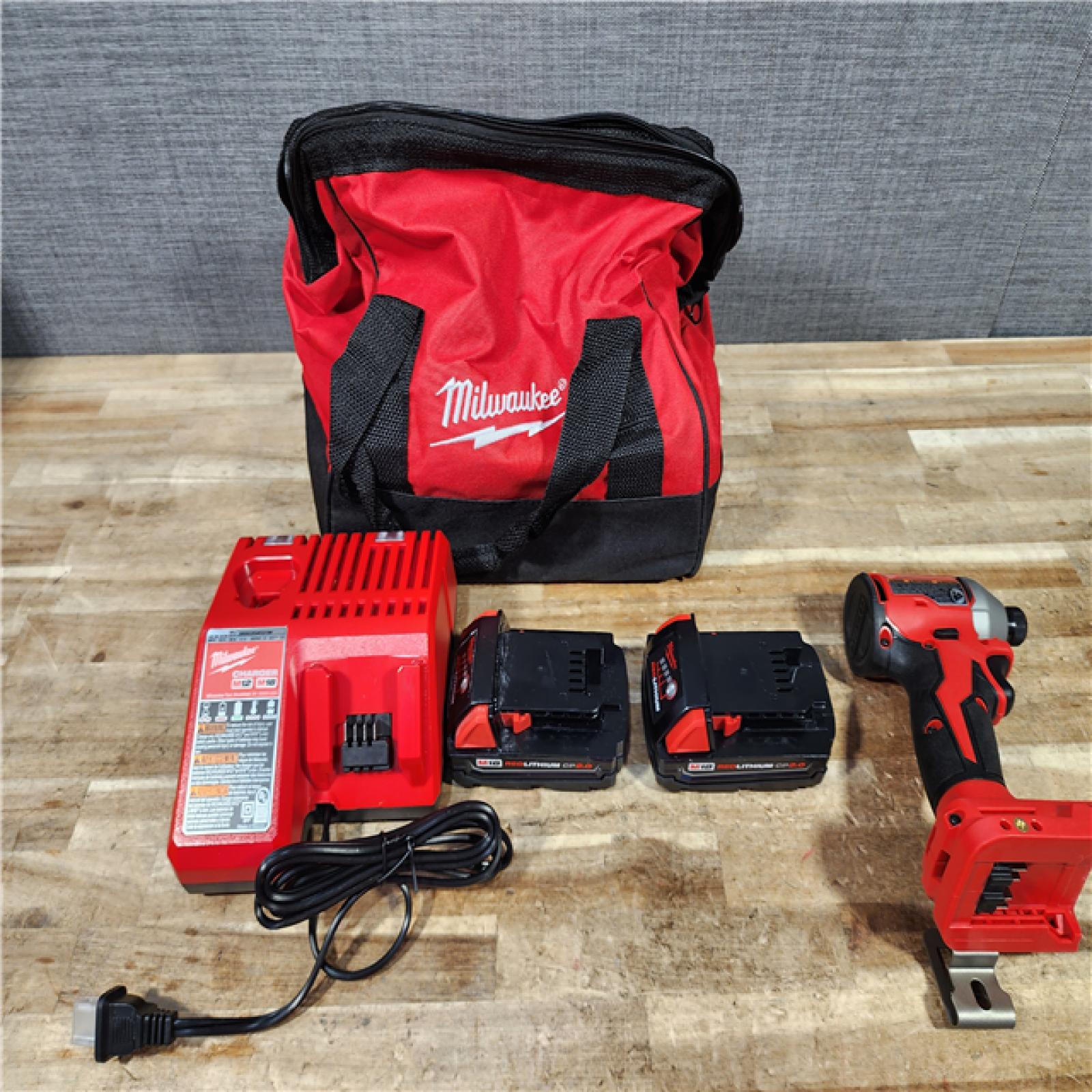HOUSTON LOCATION - AS - IS Milwaukee 18V Lithium-Ion Brushless Cordless 1/4 in. Impact Driver Kit