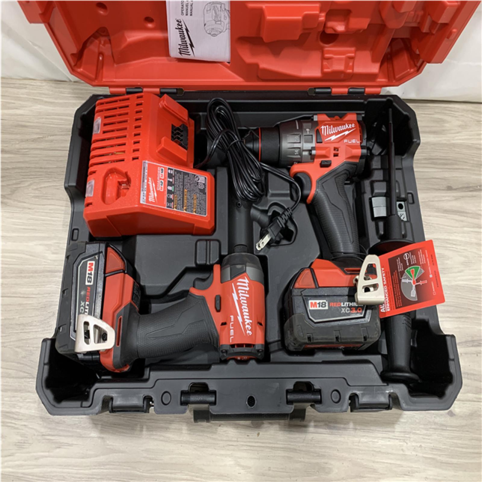 AS-IS Milwaukee FUEL 18V Lithium-Ion Brushless Cordless Hammer Drill and Impact Driver Combo Kit