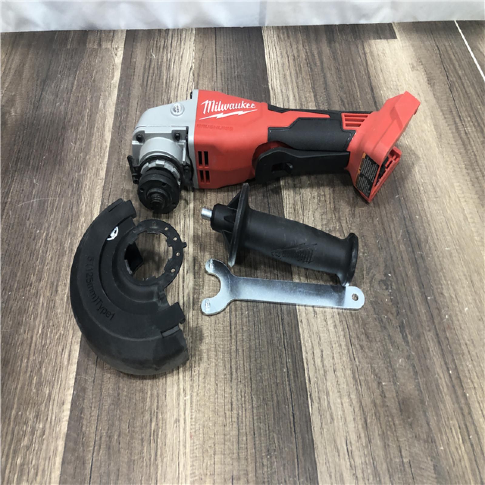 AS-IS Milwaukee 18V Lithium-Ion Brushless Cordless 4-1/2 in./5 in. Grinder w/Paddle Switch (Tool-Only)