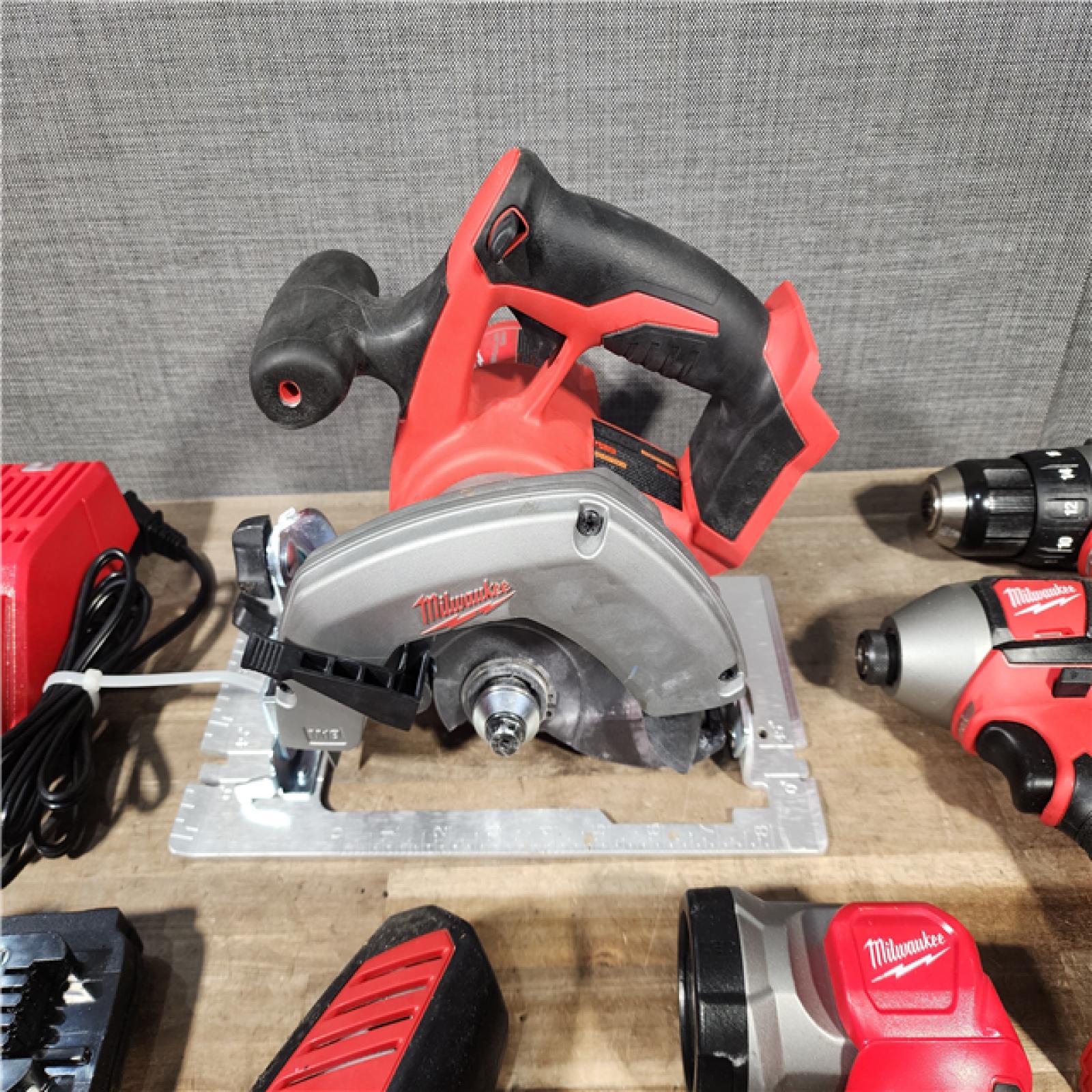 HOUSTON LOCATION - AS-IS Milwaukee M18 18-Volt Lithium-Ion Cordless Combo Tool Kit (5-Tool) with (1) 3.0Ah and (1) 1.5Ah Battery  (1) Charger  (1) Tool Bag